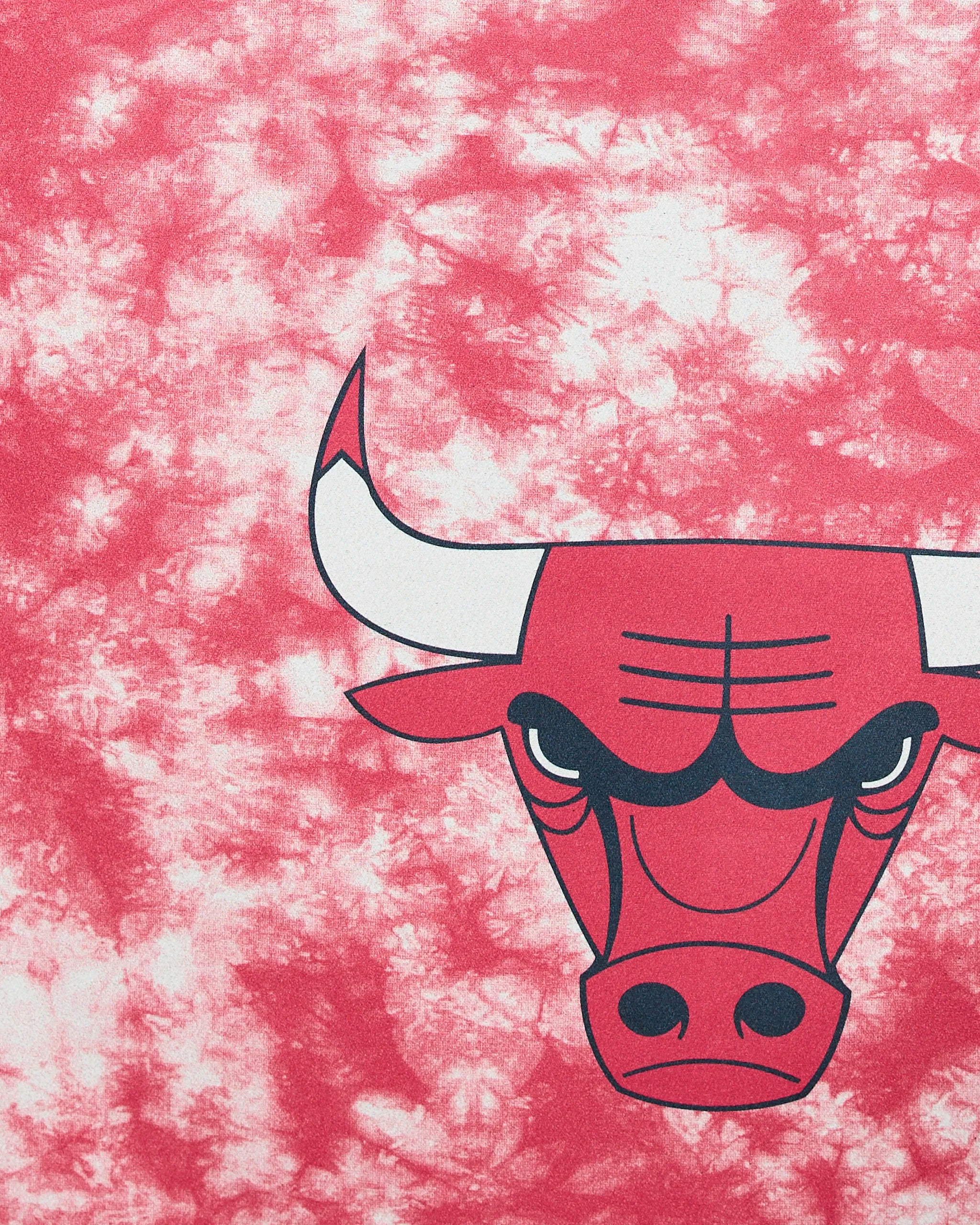 The Geometry Bulls Flash features a stylized red bull’s head with white horns and a stern look, printed on a pink and white tie-dye background. Only the right half of the bull’s face is shown.