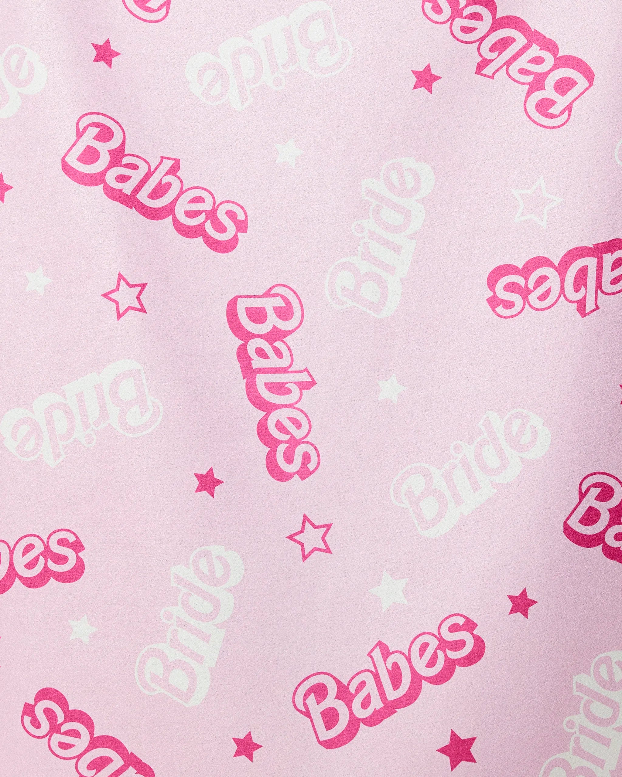 The Lets Go Party beach towel by GEOMETRY features a pink background with playful white and pink Bride and Babes lettering plus small stars—a quick-drying, fun accessory for your bridal party.