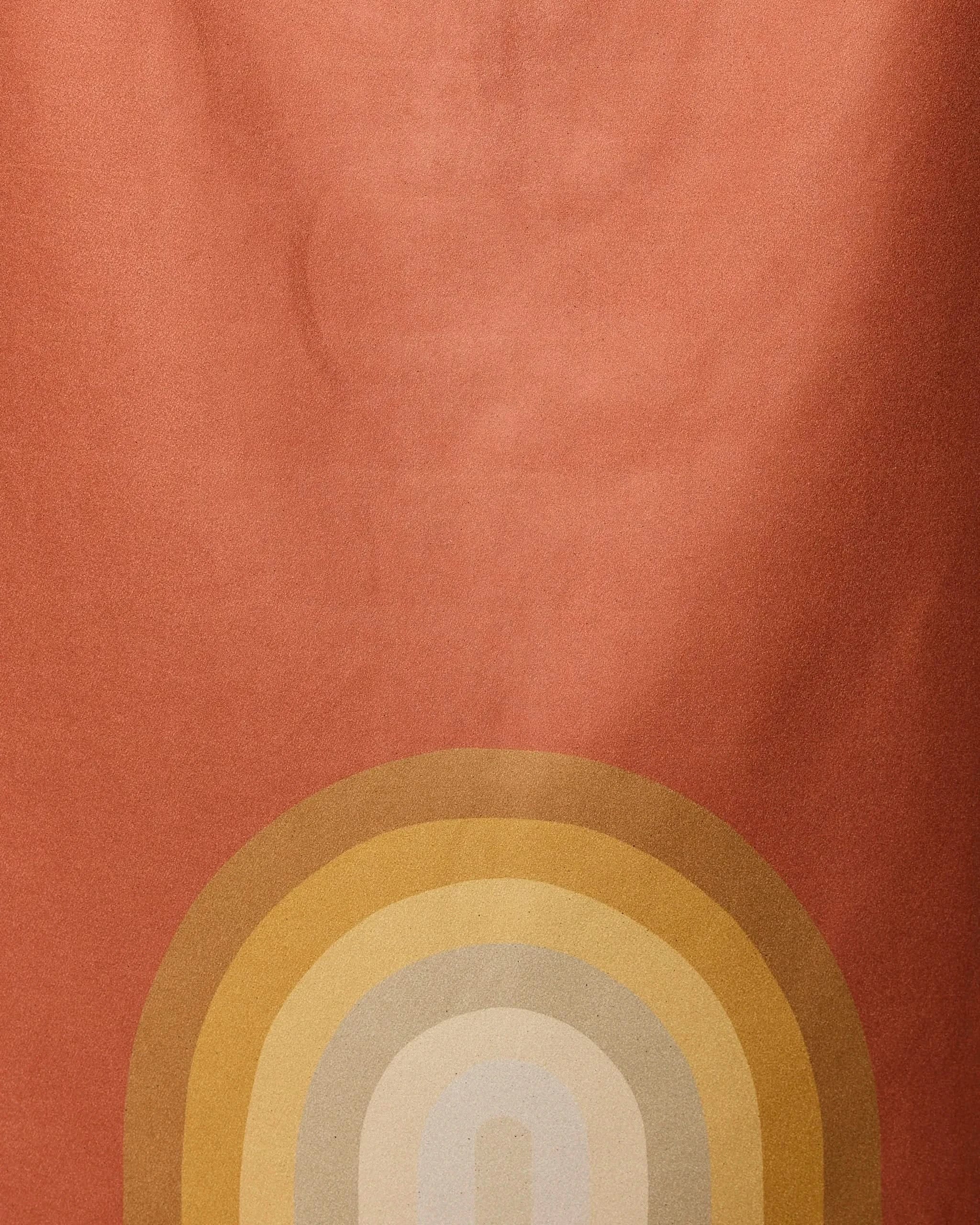 The Pumpkin Spice beach towel by GEOMETRY features an abstract design on a reddish-orange background with yellow, gold, and beige arcs—crafted from recycled materials for fast drying.