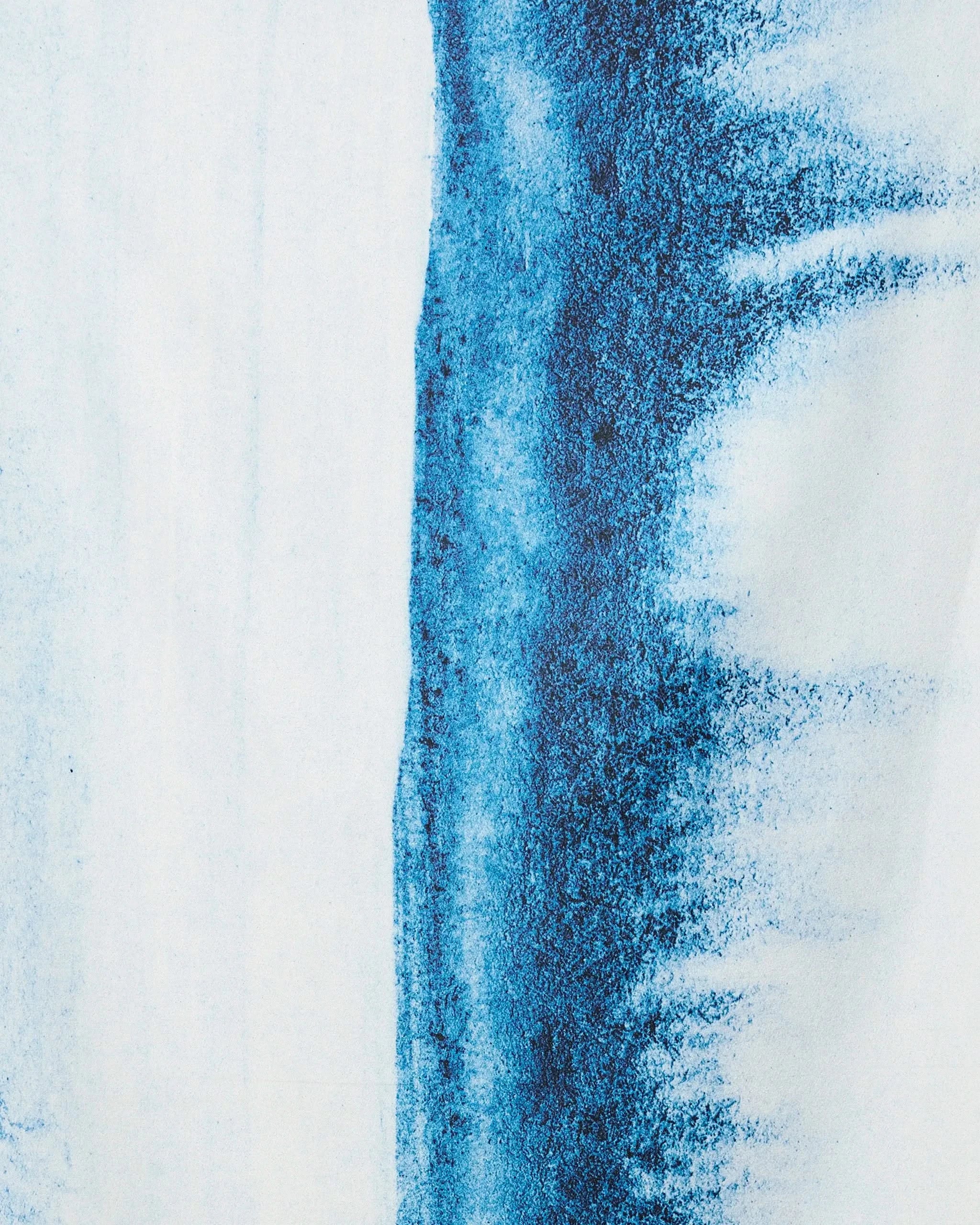 In The Distance by GEOMETRY features a striking vertical streak of dark blue on white, with the pigment fading into speckled, textured edges—evoking the look of quick-drying beach towel fabrics.