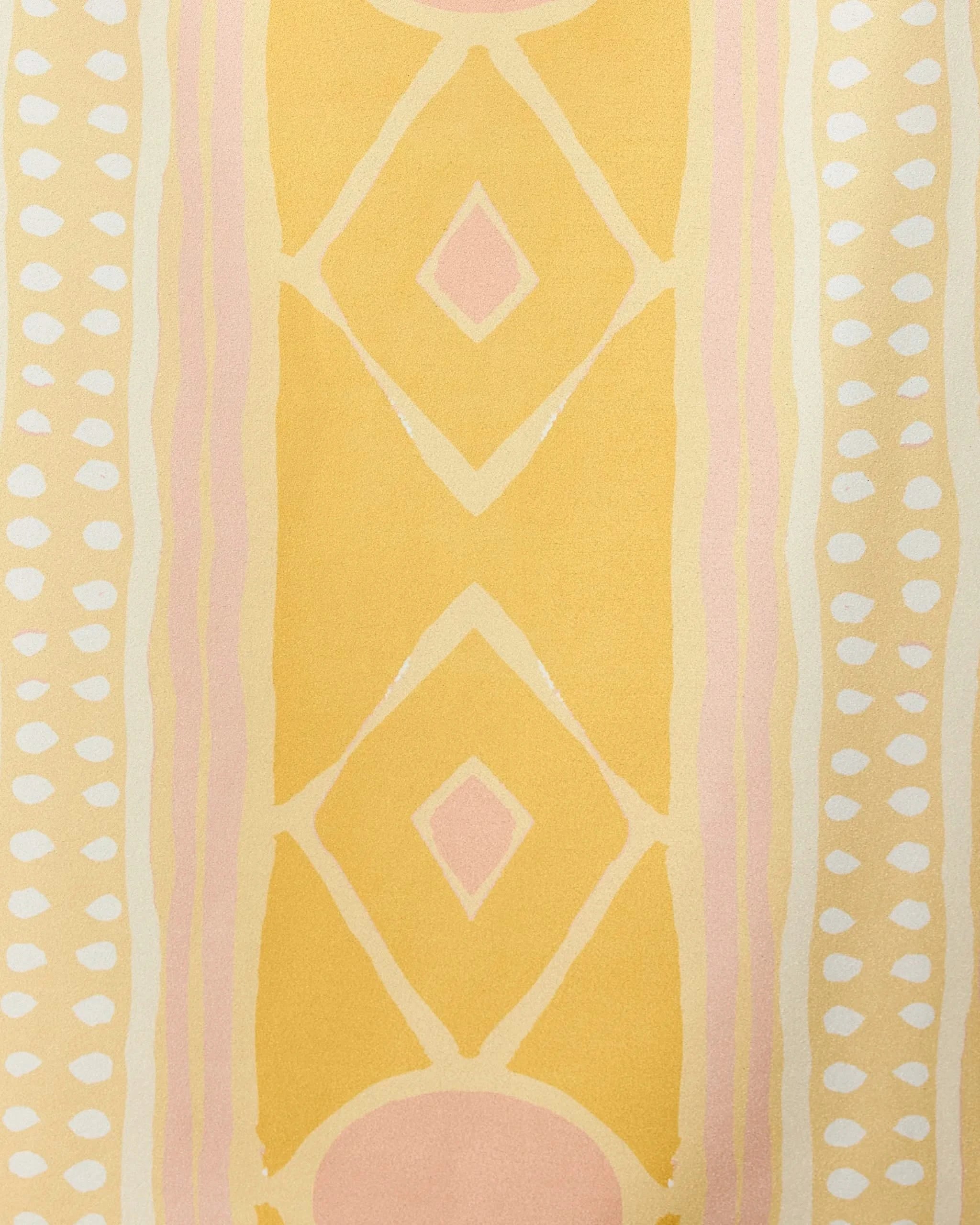 The Beaded beach towel by GEOMETRY showcases yellow and pale pink diamonds, pink ovals, and vertical white dot rows on a light yellow background. Quick-drying with a soft, watercolor effect for stylish comfort.