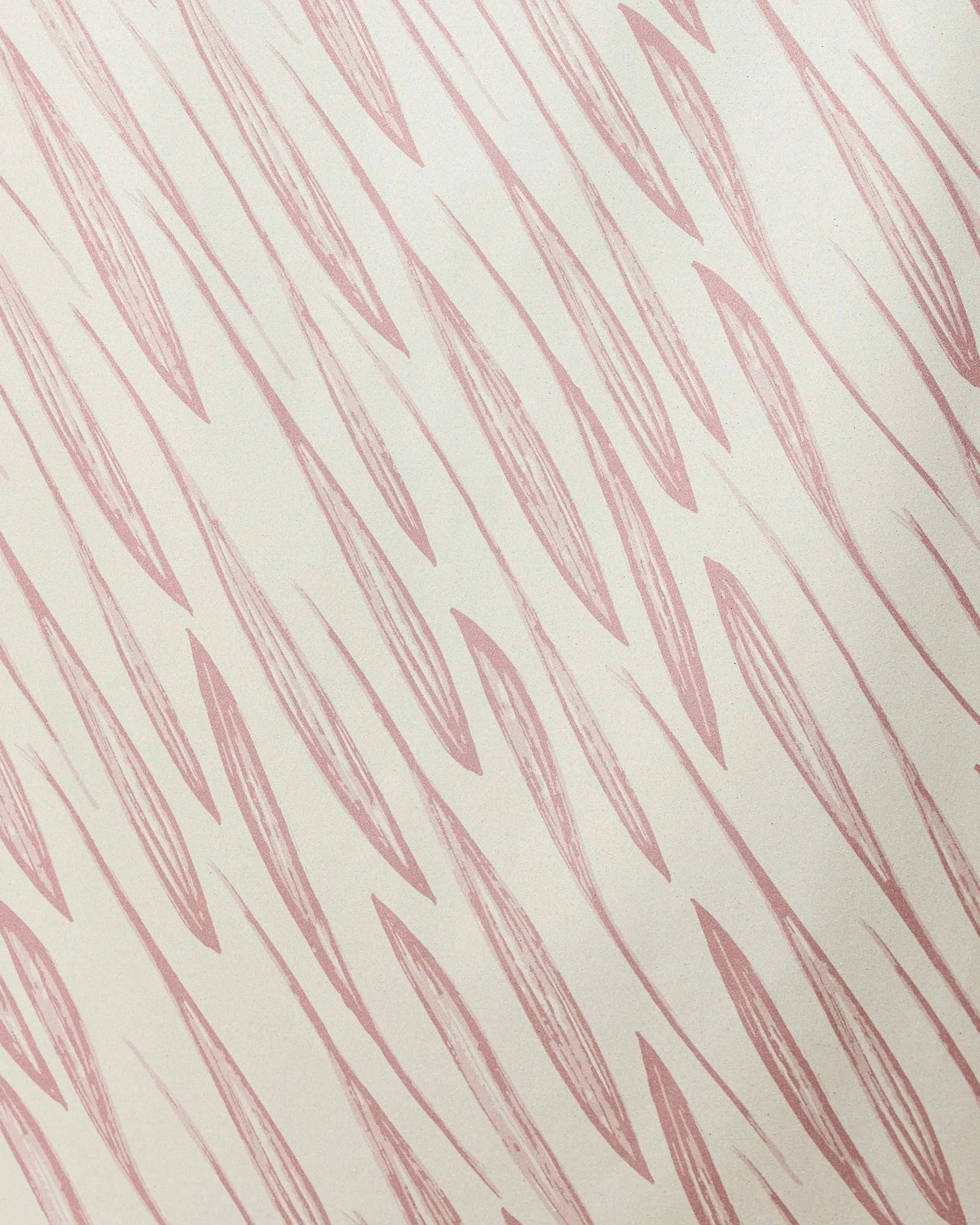 Light pink, elongated leaf-like shapes repeat diagonally on a beige background in the Calm Winds Micro-loop Beach Towel by GEOMETRY. Made from recycled materials, it delivers quick-drying performance and eco-friendly style.