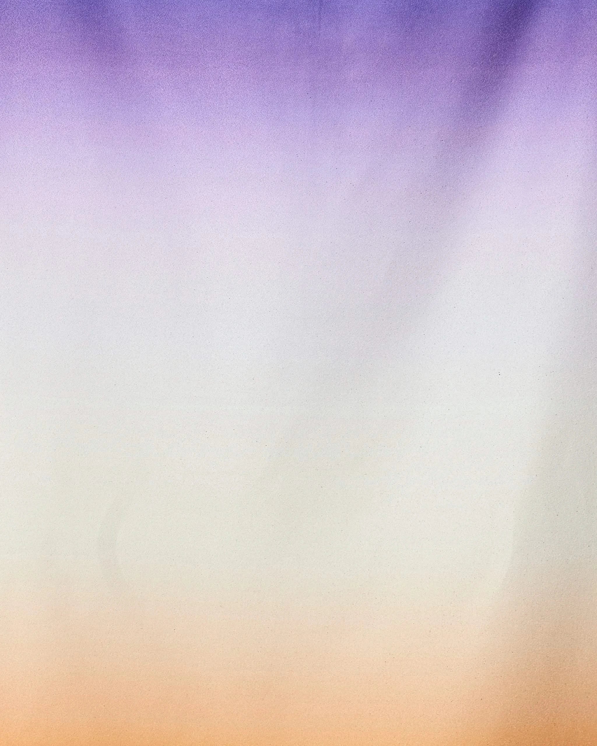 A soft gradient background transitions from purple to white to orange, evoking the Radiant quick-drying micro-loop beach towel by GEOMETRY, crafted from recycled materials with a smooth, calming color flow.
