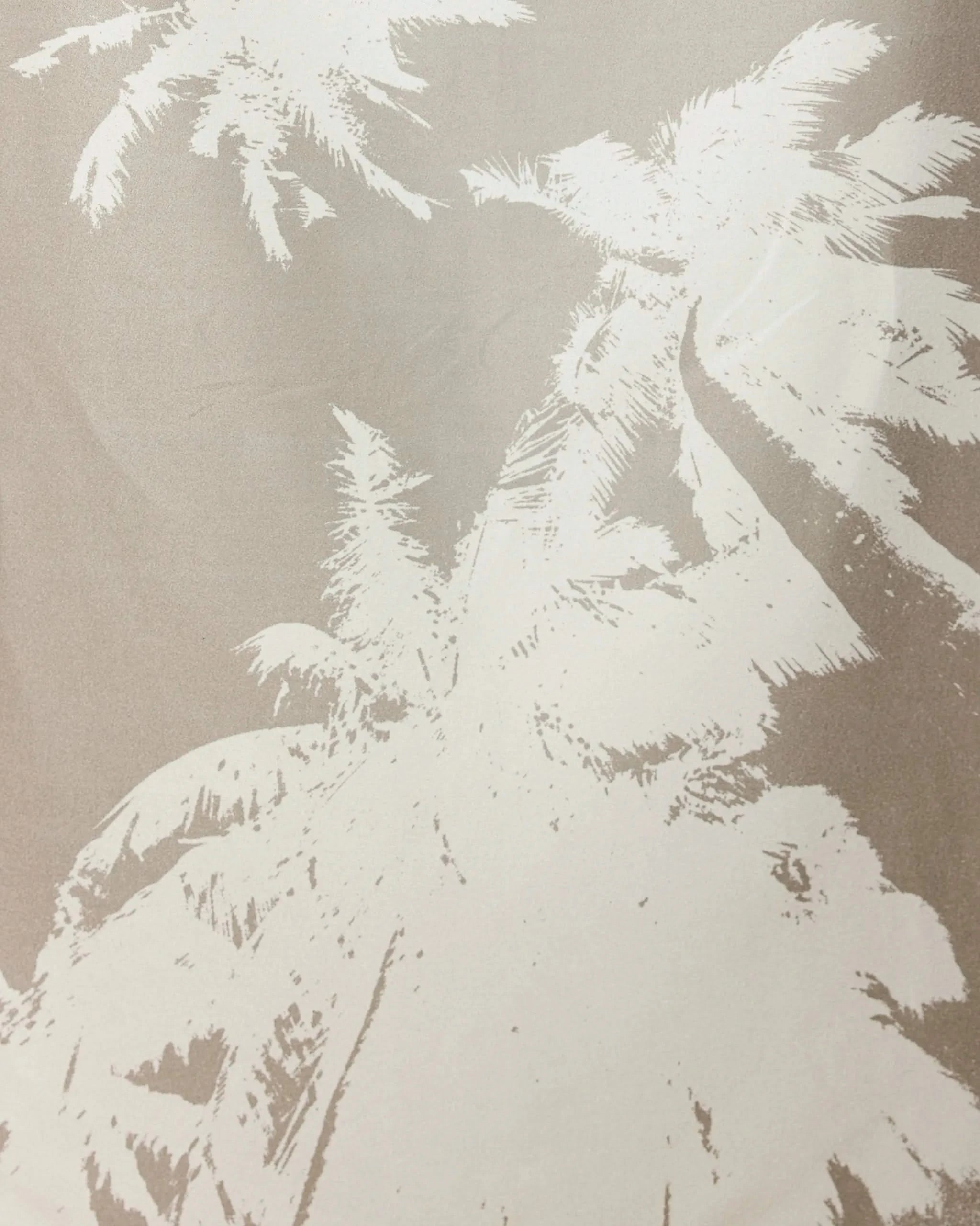 Beige-toned image featuring a white, stylized illustration of tall palm trees—like those on our GEOMETRY Sandy Palms towel—seen from below, with fronds spreading out toward the edges of the frame.