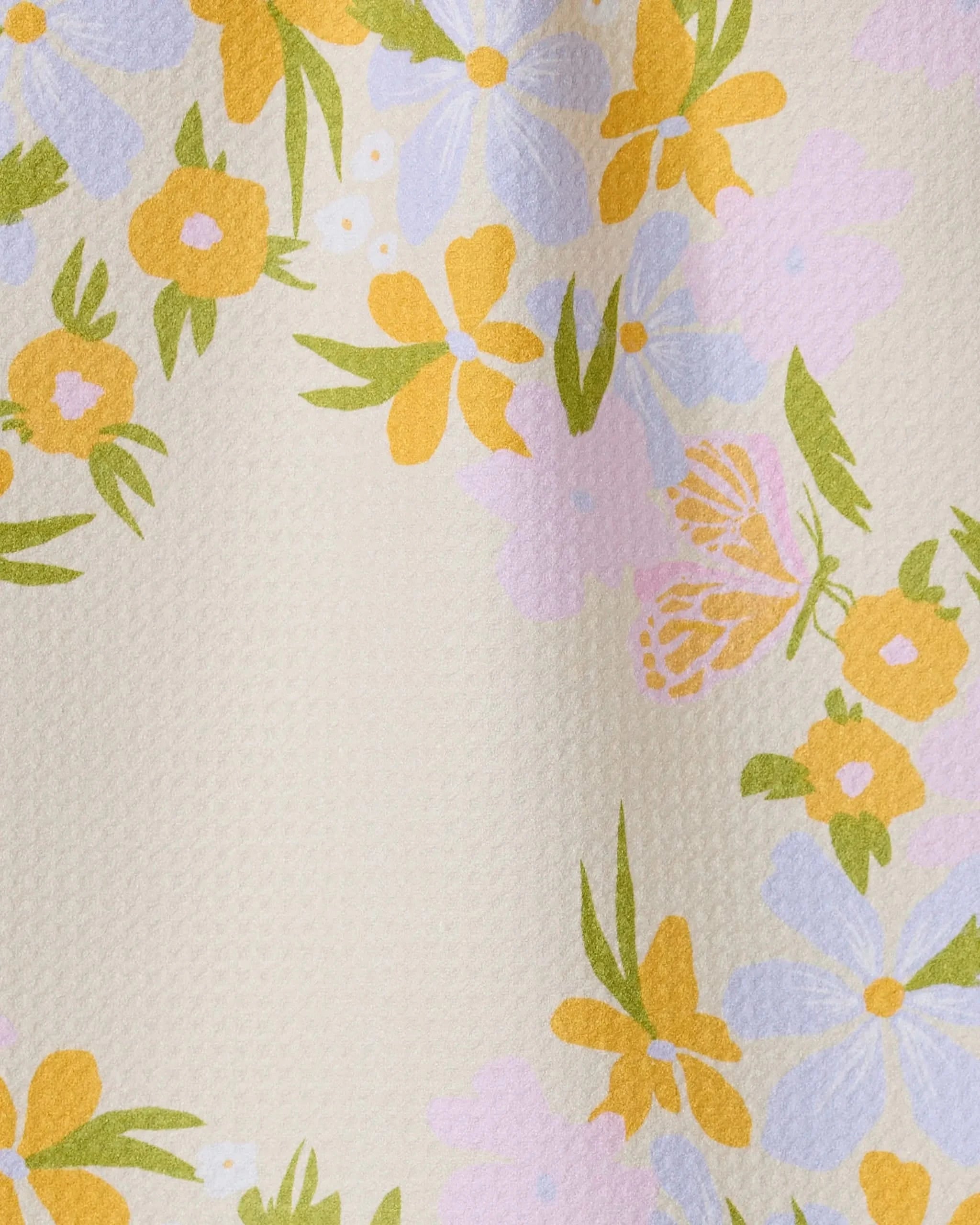 The GEOMETRY Abloom bar towel features a textured cream surface with clusters of yellow, lavender, and pink floral patterns and green leaves. Made from ultra-absorbent recycled materials, it blends beauty with practicality.