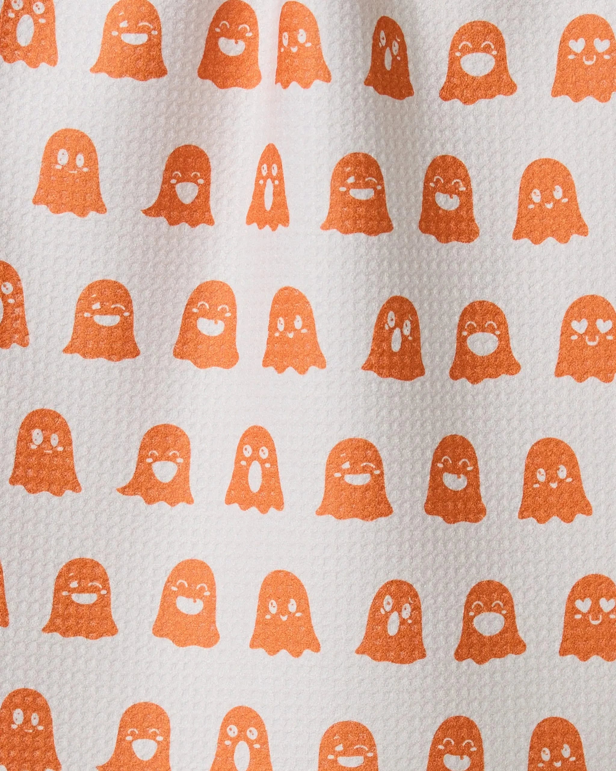 The Geometry Emotional Boos bar towel features rows of small, orange ghost-like figures with cute faces on a light background and is made from recycled materials.