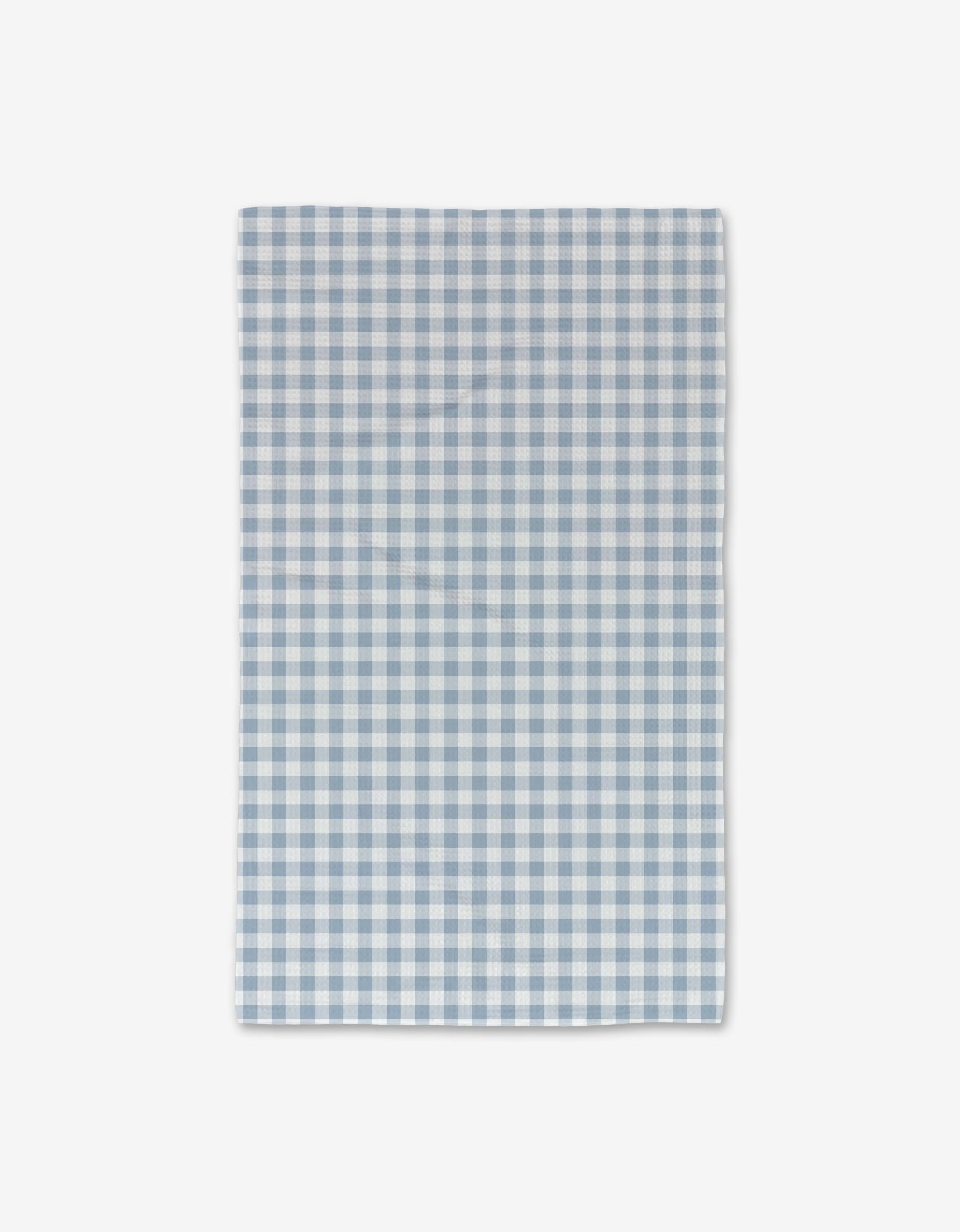 The Aubrey Fairchild Blue Gingham Luxe Hand Towel, featuring a light blue and white check pattern, is ultra-absorbent, dries quickly, and brings stylish practicality to your kitchen.