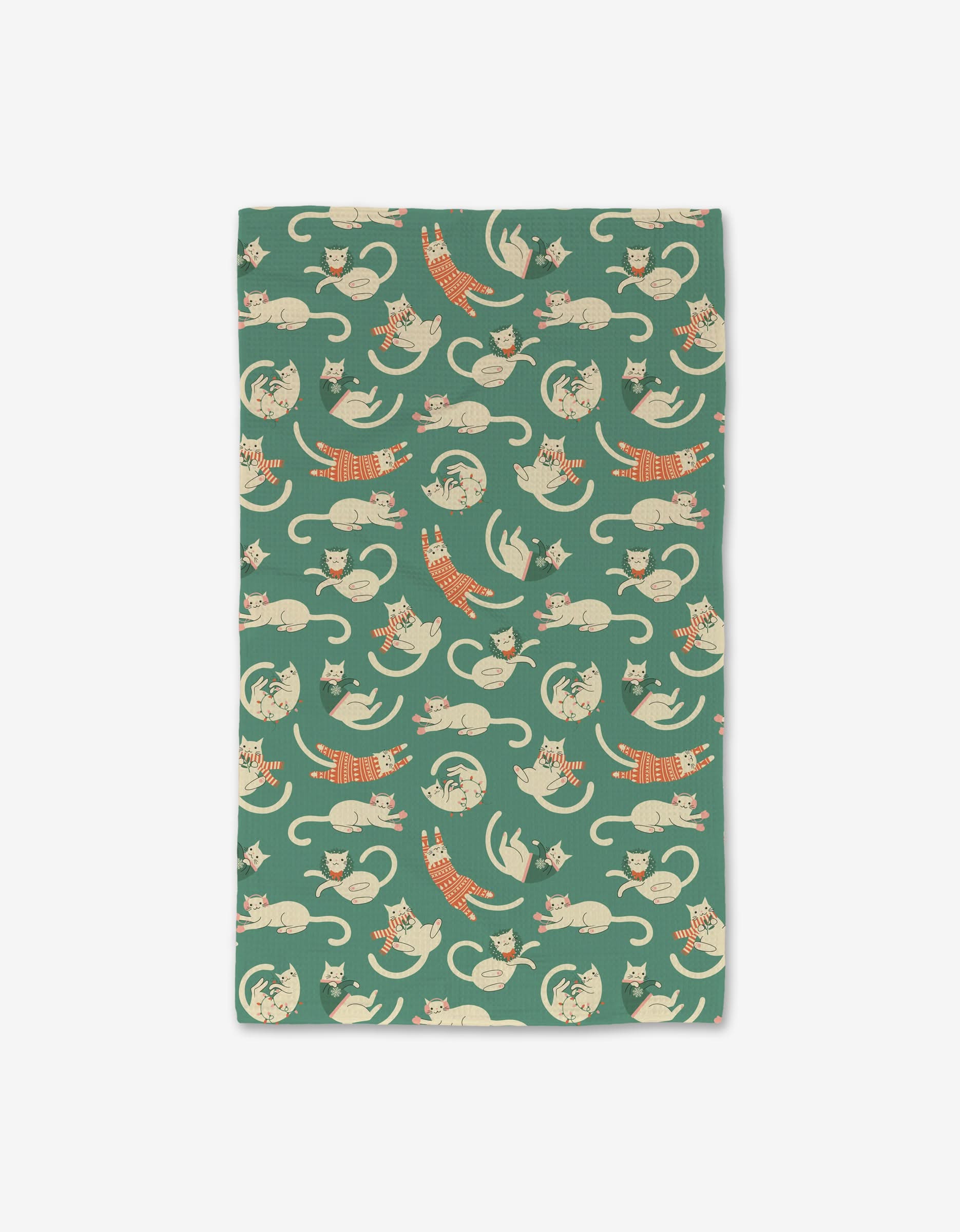 The Christmas Cats cloth by Megan Kampa features playful orange and beige cats in various poses on a green Geoweave fabric, combining ultra-absorbency with festive charm.