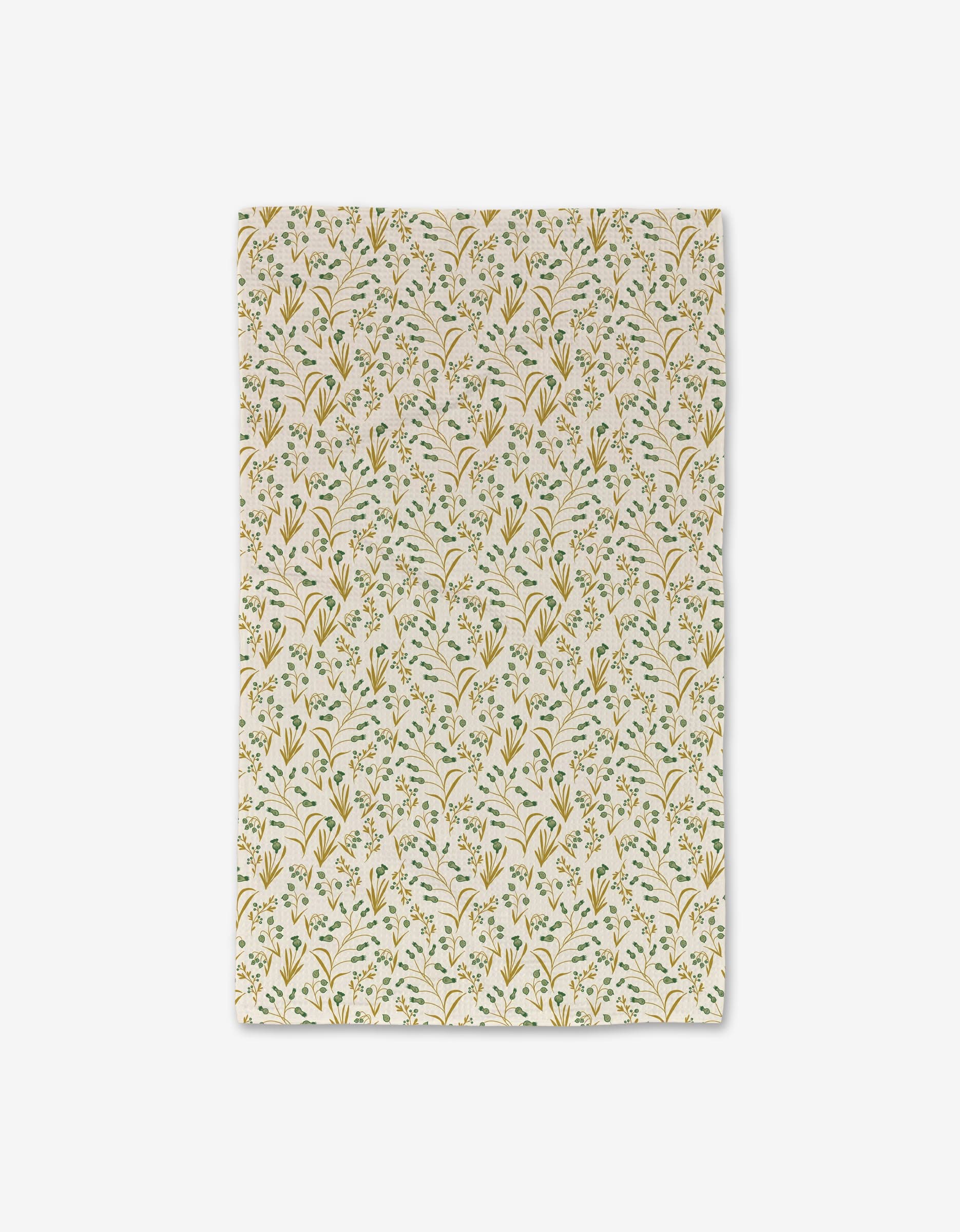 The Danelys Sidron Wildlight Hand Towel is cream-colored with a repeating yellow and green floral sprigs pattern, crafted with Geoweave technology for ultra absorbency, shown rectangular and laid flat on a white background.
