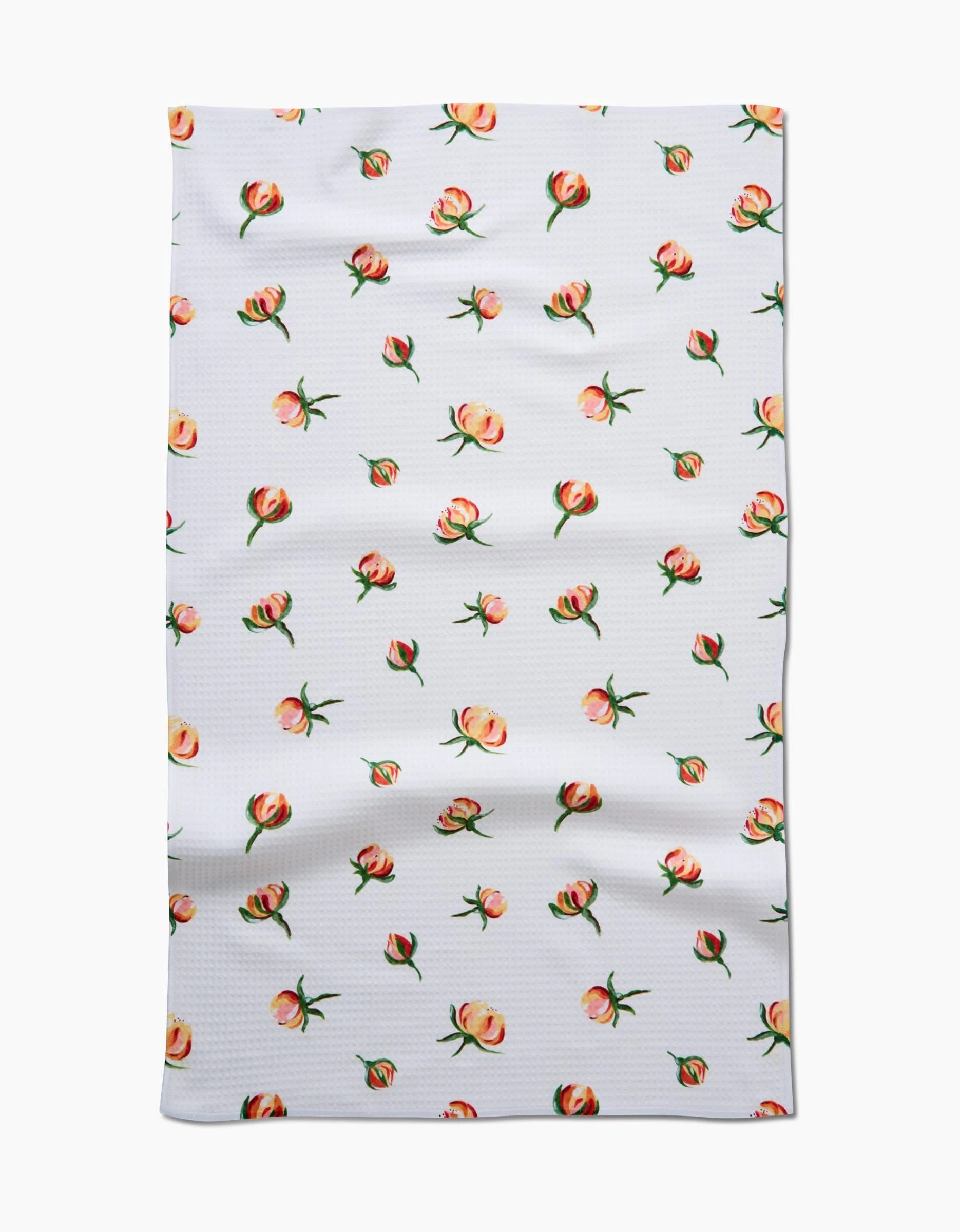 Linda Foxs Yellow Rosebuds features a white fabric with small yellow rosebuds and green stems evenly scattered across the surface. Slightly wrinkled, this ultra-absorbent material is perfect for Luxe Hand Towels.