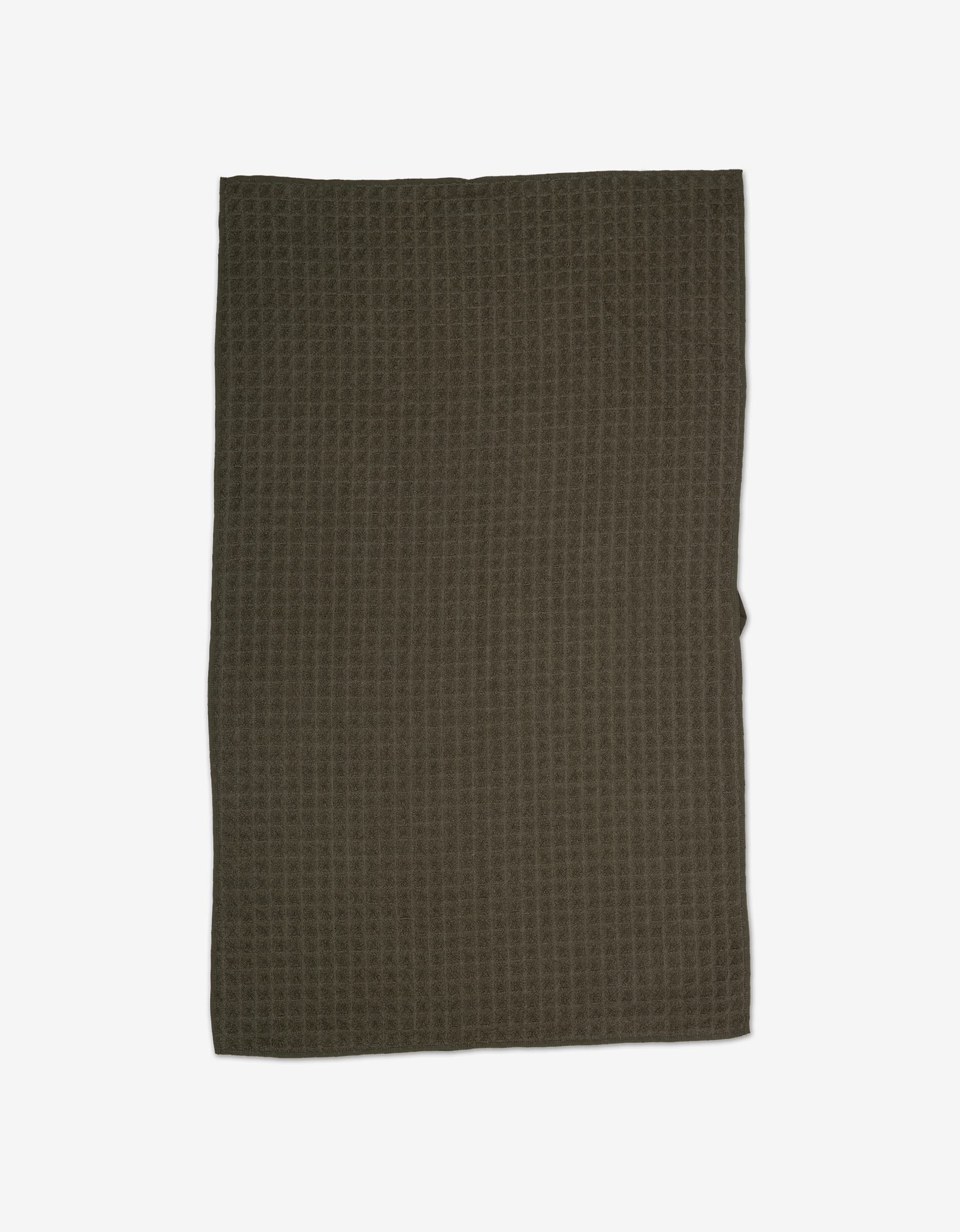 The GEOMETRY “Forest” Waffle Hand Towel features a dark olive green, rectangular design with a waffle weave texture—perfect for adding style to your kitchen.