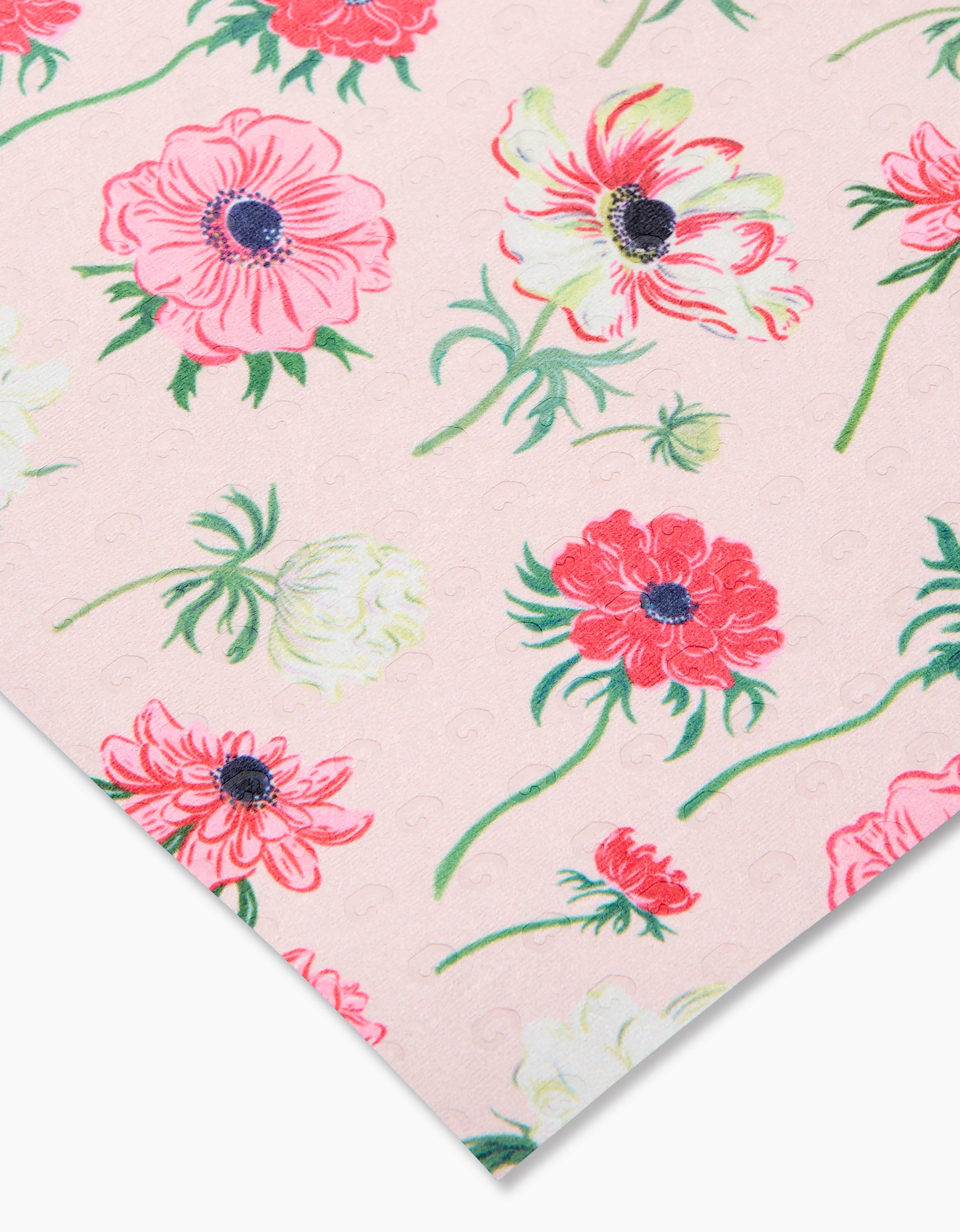 Close-up of Anemone Garden Flowers fabric by Linda Fox, showing red, pink, and white floral patterns with green leaves on a pink background. Eco-friendly and made from post-consumer recycled materials—not paper towels.