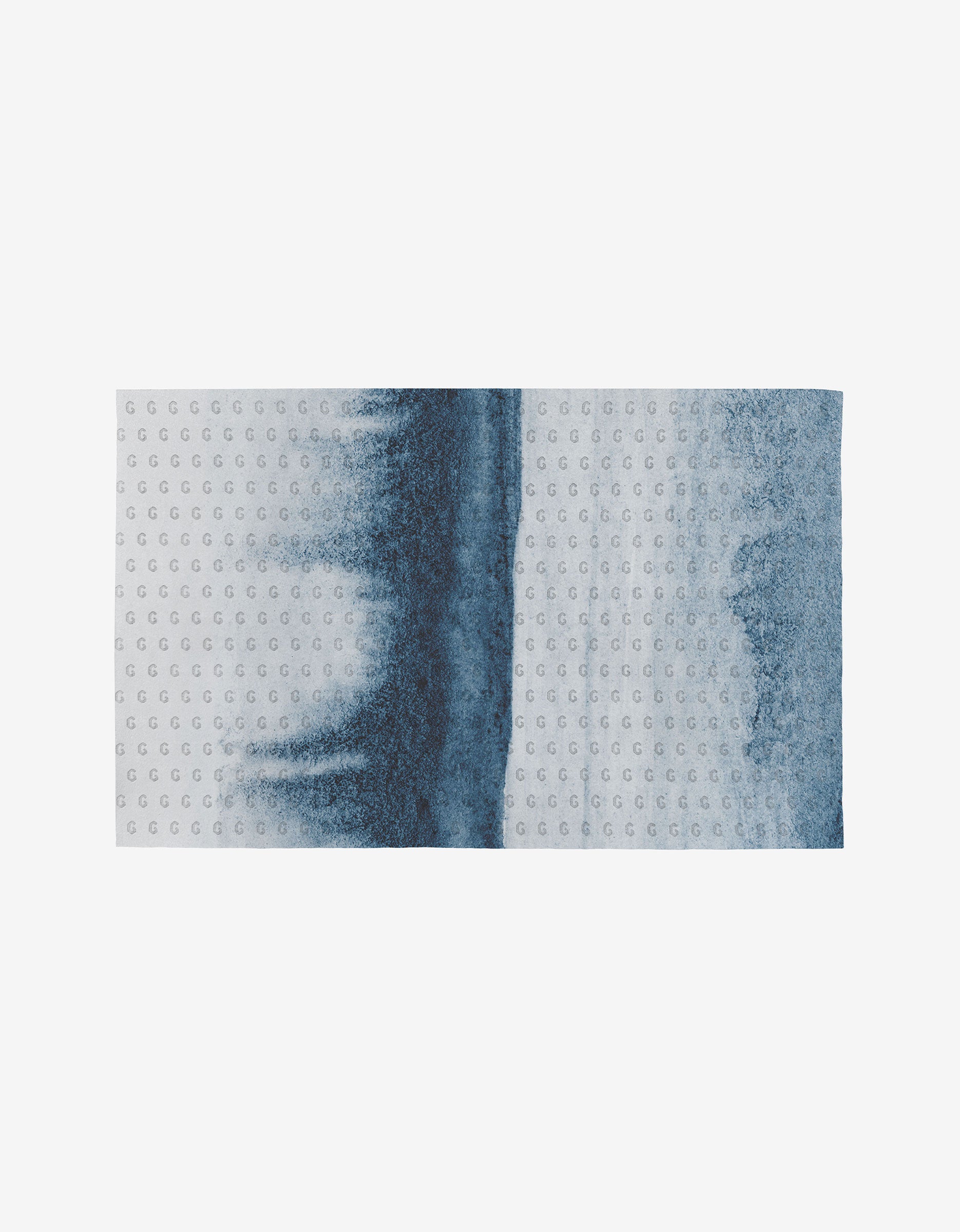 The GEOMETRY Artistic mat is rectangular with small raised dots and a letter G, featuring an abstract blue gradient on a light background, and is made from environmentally friendly post-consumer recycled materials.
