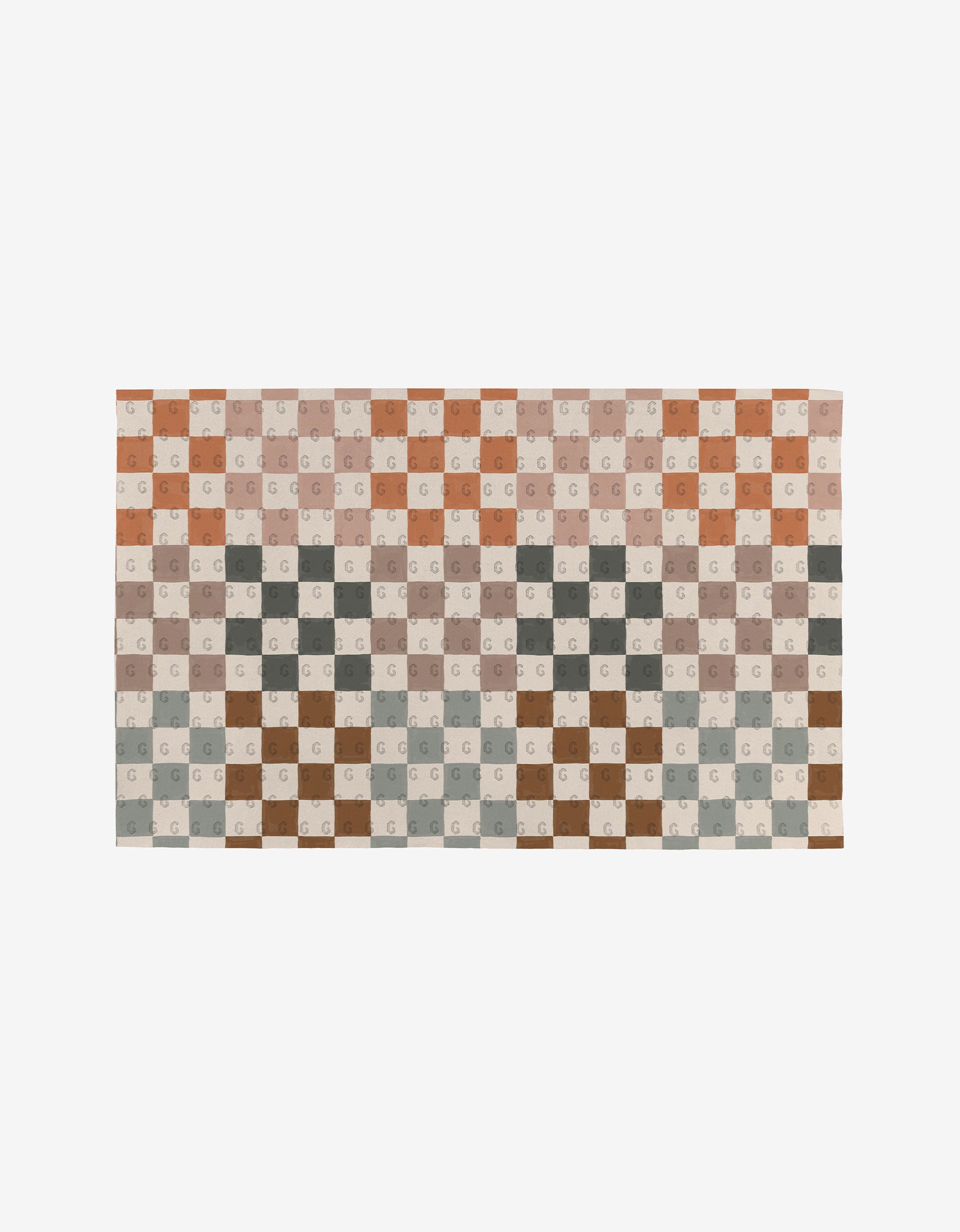 The GEOMETRY Autumn Checkers rug showcases a checkered pattern in muted brown, beige, gray, and rust tones with subtle “G” letters—an eco-friendly decor piece—displayed on a plain white background.