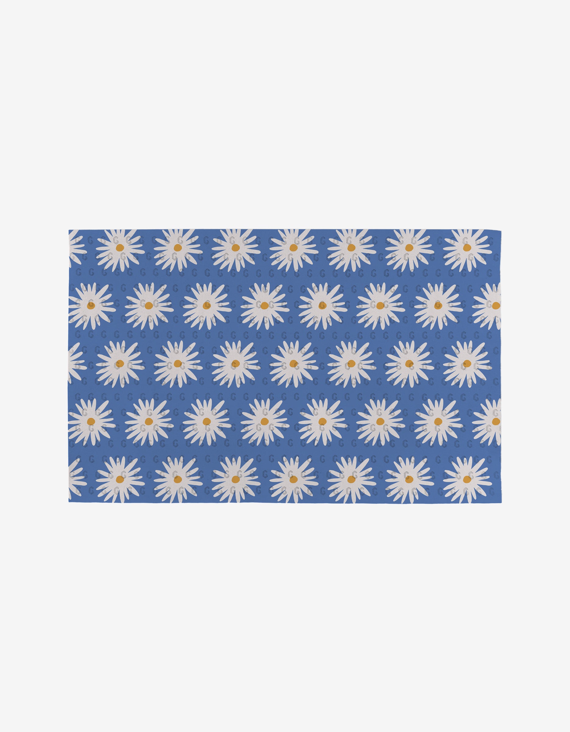 Megan Roy’s Blue Daisies is a rectangular blue mat with evenly spaced white daisies featuring yellow centers—a reusable, eco-friendly alternative to Not Paper Towels.
