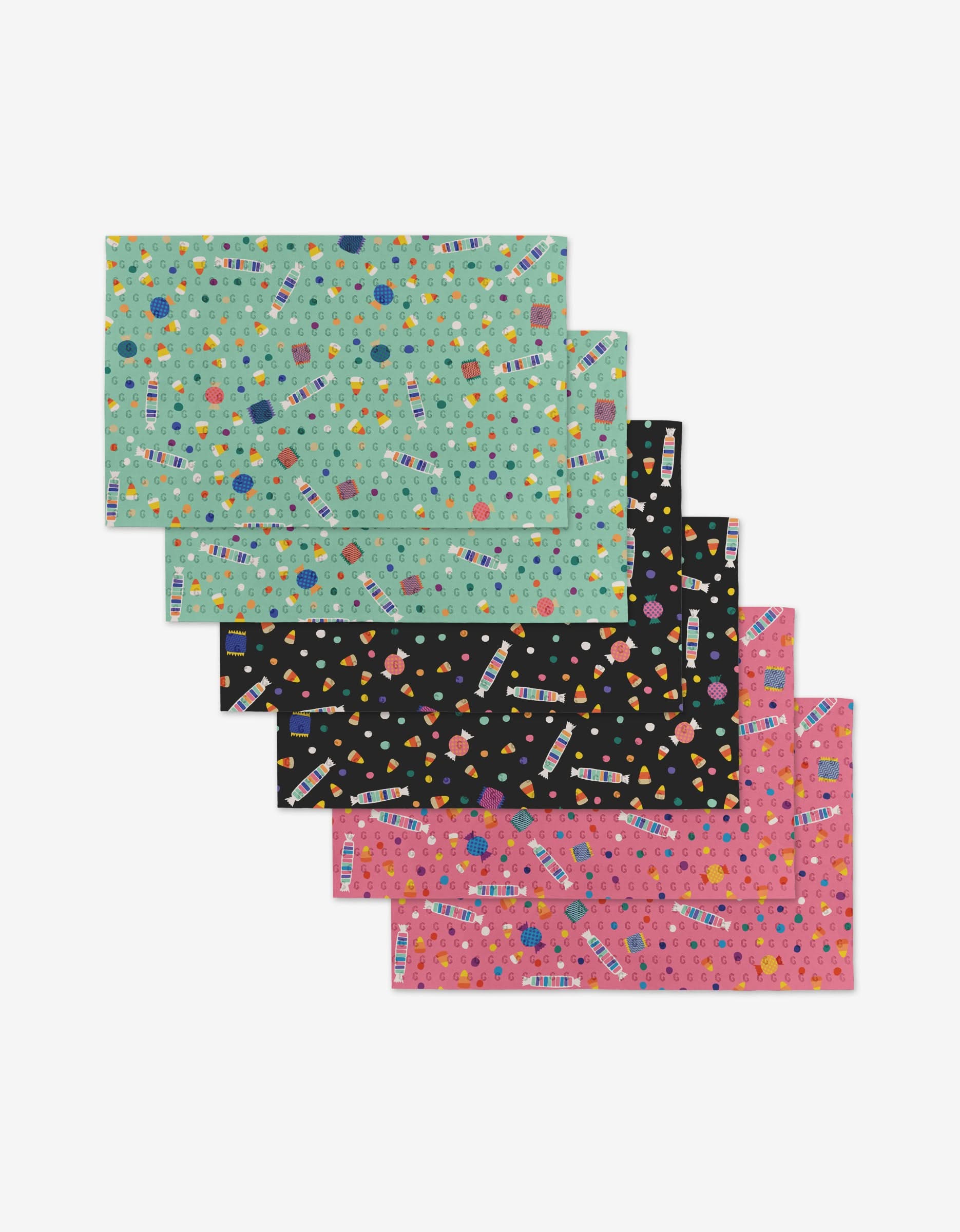 Candy Rush by Rebecca Bobko: a set of six reusable rectangular placemats in teal, black, and pink, each with vibrant geometric patterns and the word “HELLO”—a stylish, eco-friendly alternative to Not Paper Towels.