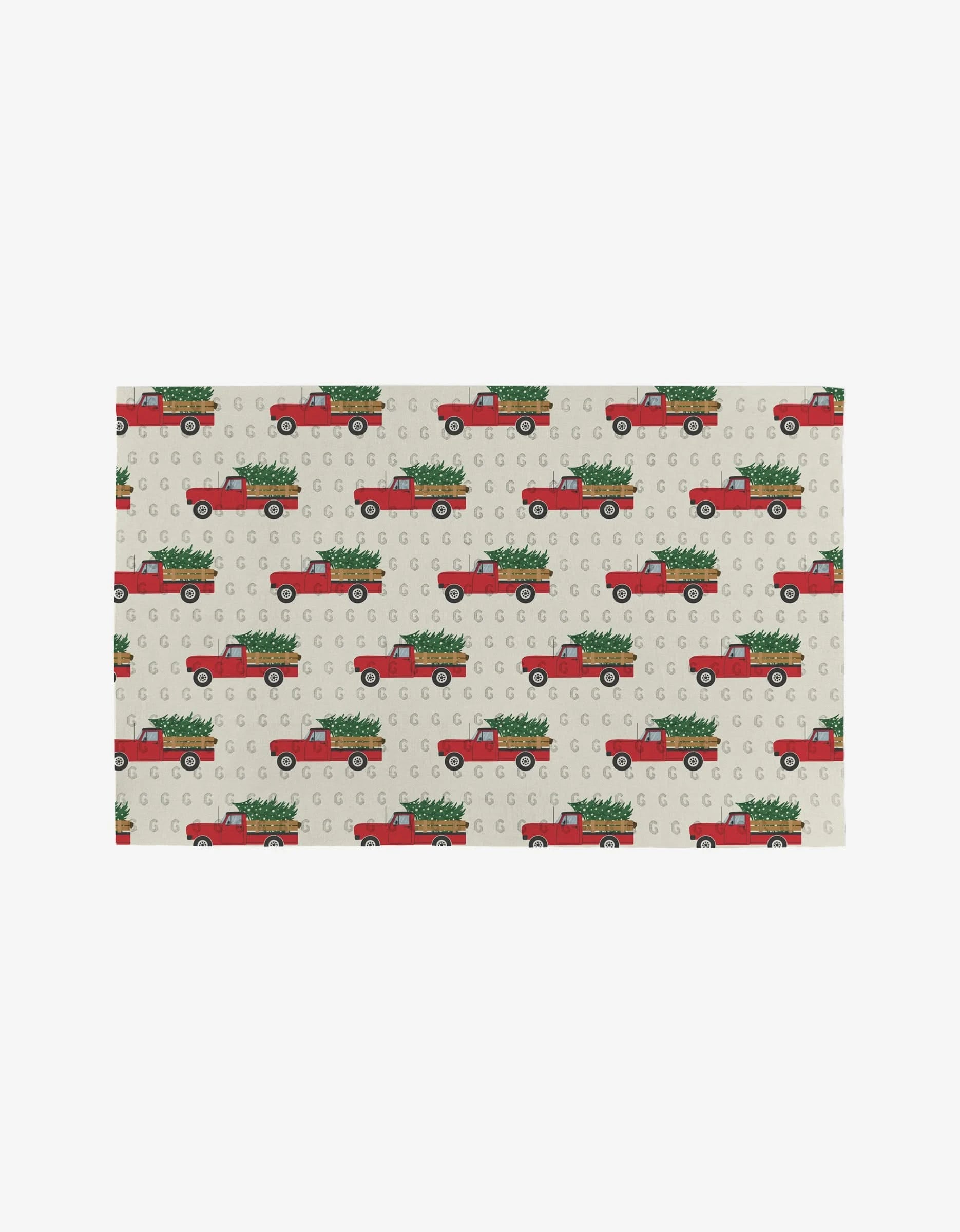 Christmas Ride by Megan Kampa features red vintage trucks with Christmas trees on beige, dotted Not Paper Towels—an eco-friendly home alternative.