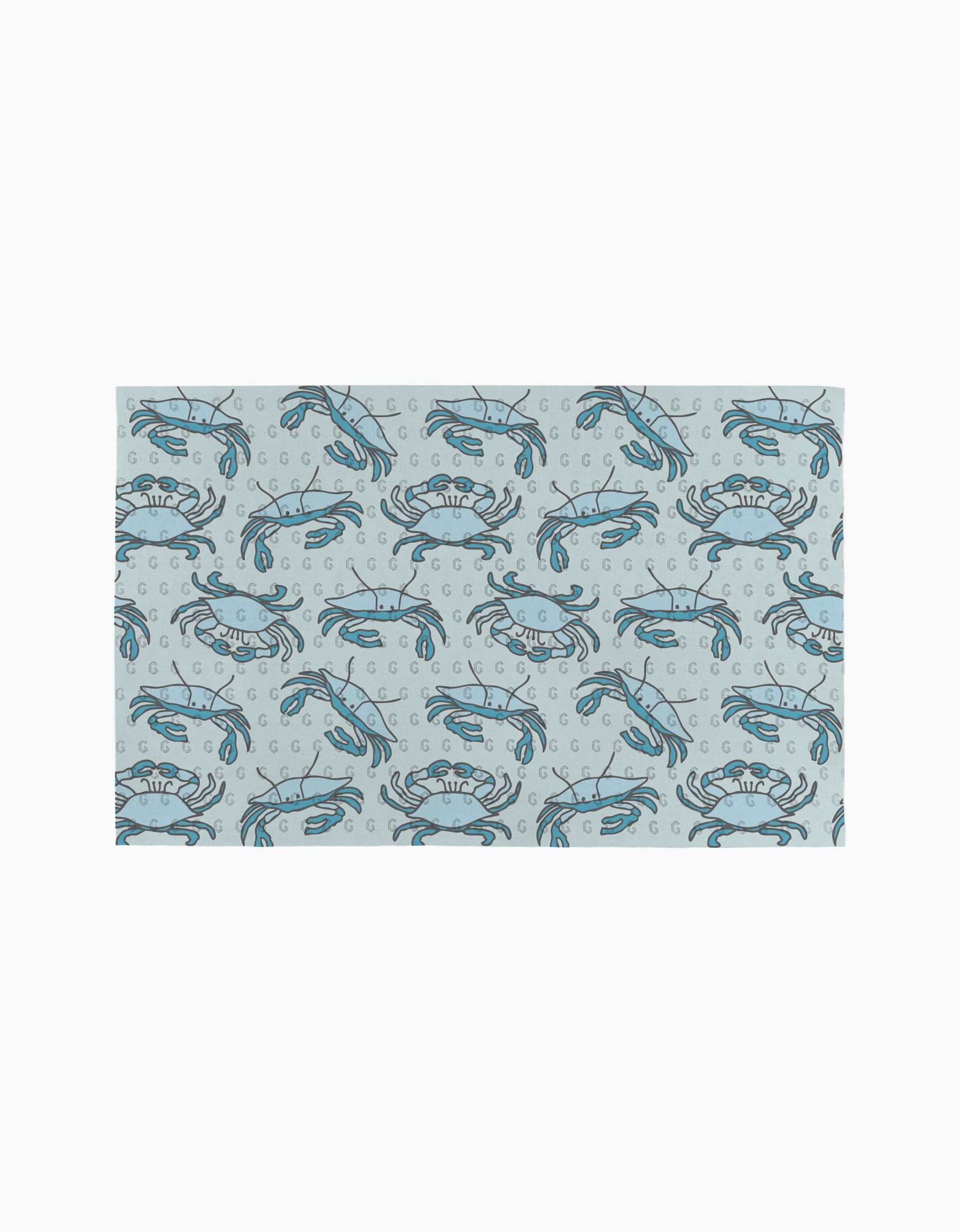 The Mindfulnice Coastal Crew mat features a repeating blue crab and bubble pattern on light gray, inspired by eco-friendly paper towels.