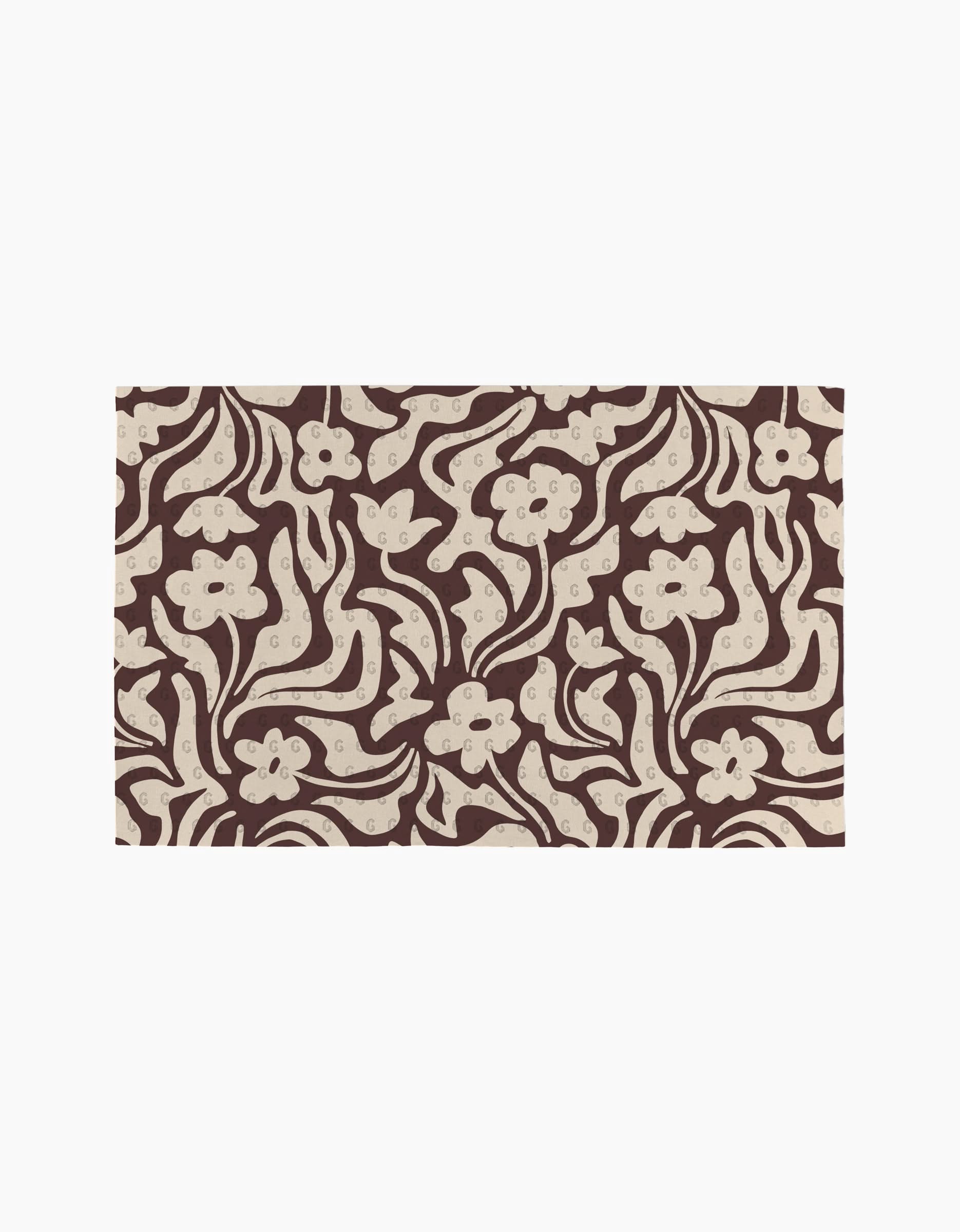 Coffee Reverie by Gerdadzy features an abstract floral pattern with cream flowers and swirls on a brown backdrop—ideal for stylish, eco-friendly kitchen towels or as a recycled paper towel alternative.