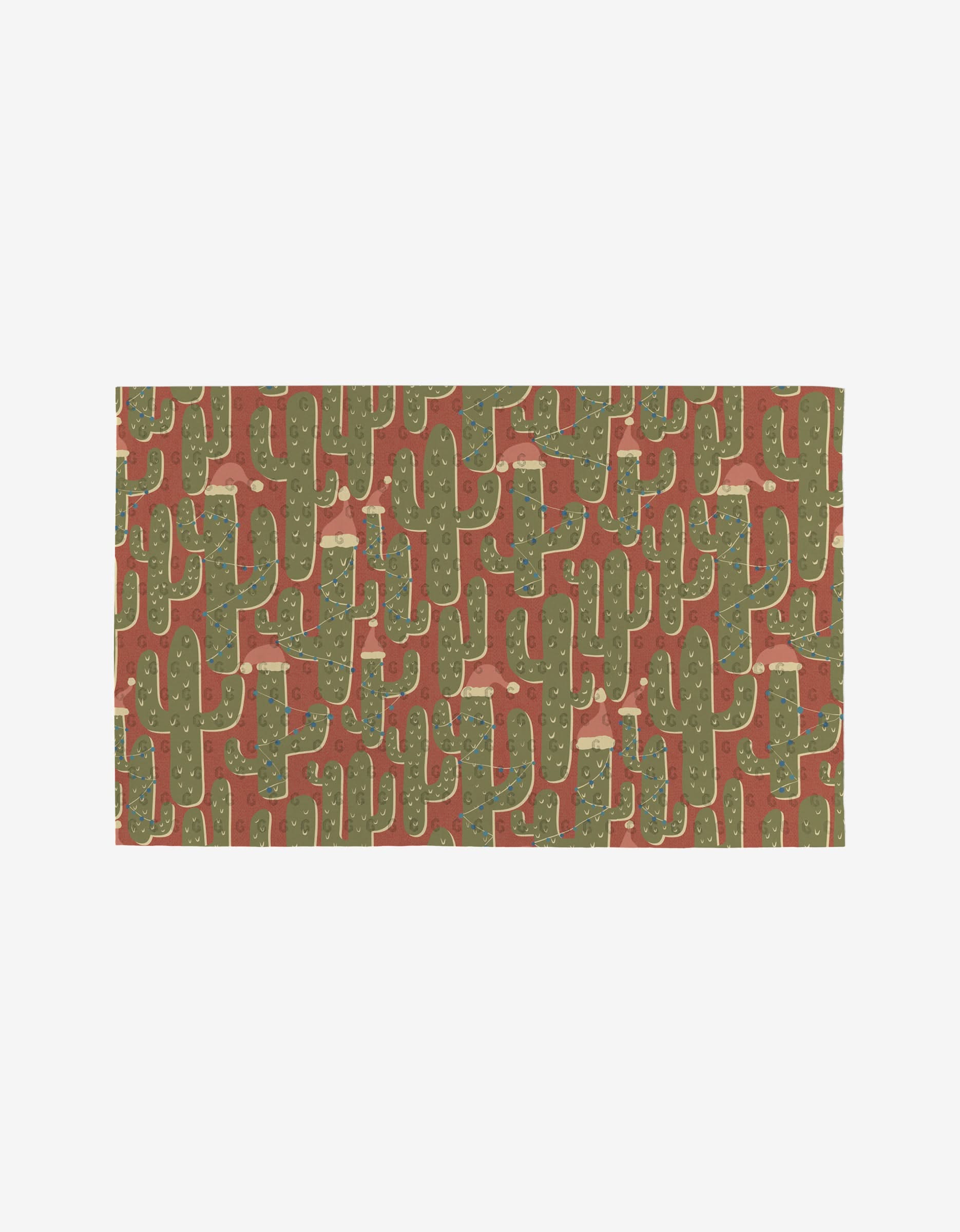 Cowboy Winter by Julianne Haness: a rectangular mat with a playful, Southwest-inspired cactus pattern on rust. Made from post-consumer recycled materials, it’s an eco-friendly, stylish choice.