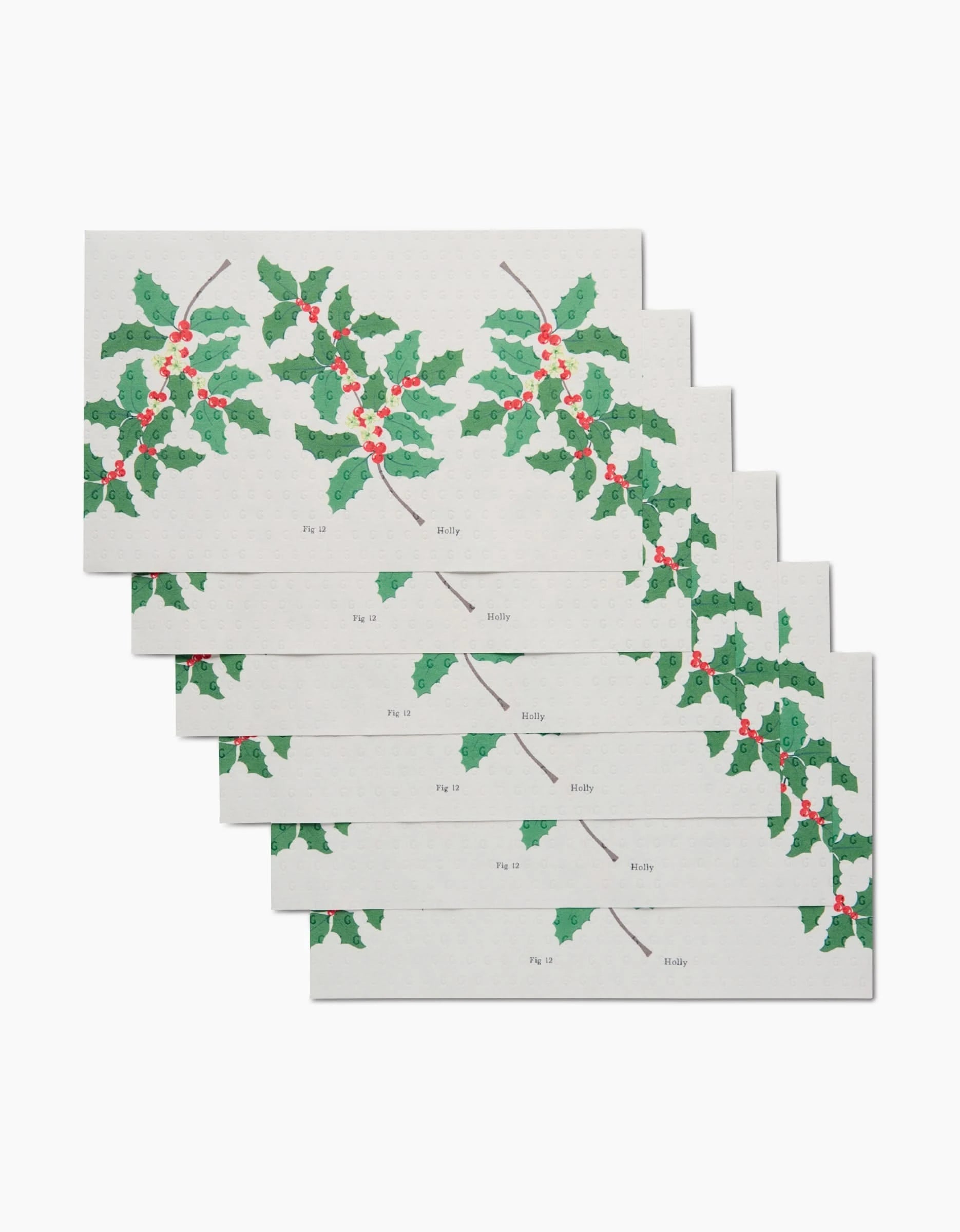 Six December Holly cards by Linda Fox, stacked and rectangular, each display holly branches with green leaves and red berries on a white background. Made from eco-friendly materials, holly is labeled near the leaves.