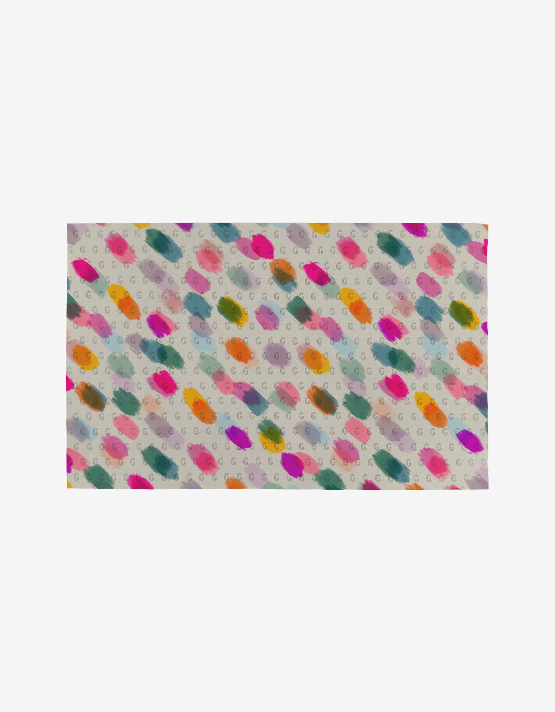 Downpour by GEOMETRY is a rectangular fabric featuring colorful paint-like splotches and small gray “G” letters on a light background, made from post-consumer recycled materials for an eco-friendly towel alternative.