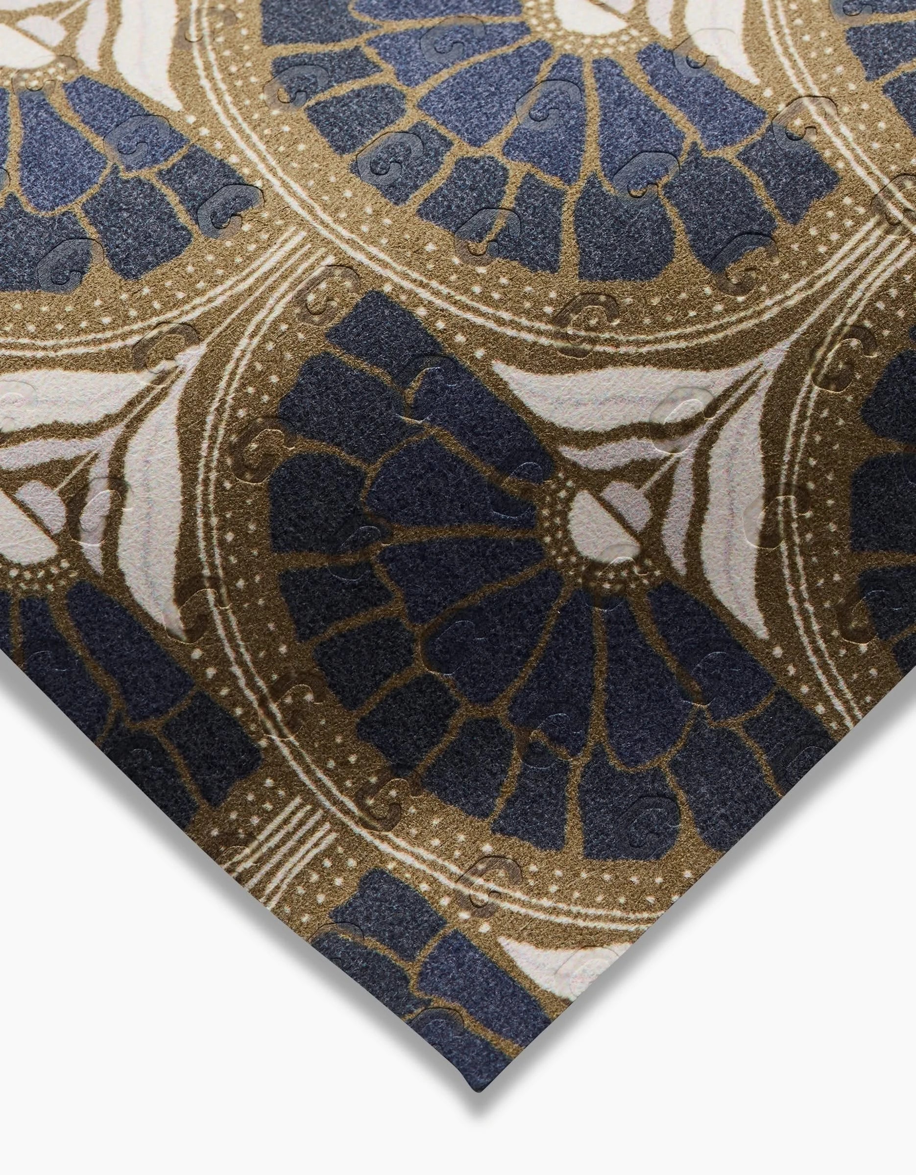 A close-up of Eliza by Amy MacCready shows intricate gold, white, and dark blue geometric and floral patterns. The textured detail shines—an elegant, eco-friendly alternative to Not Paper Towels.
