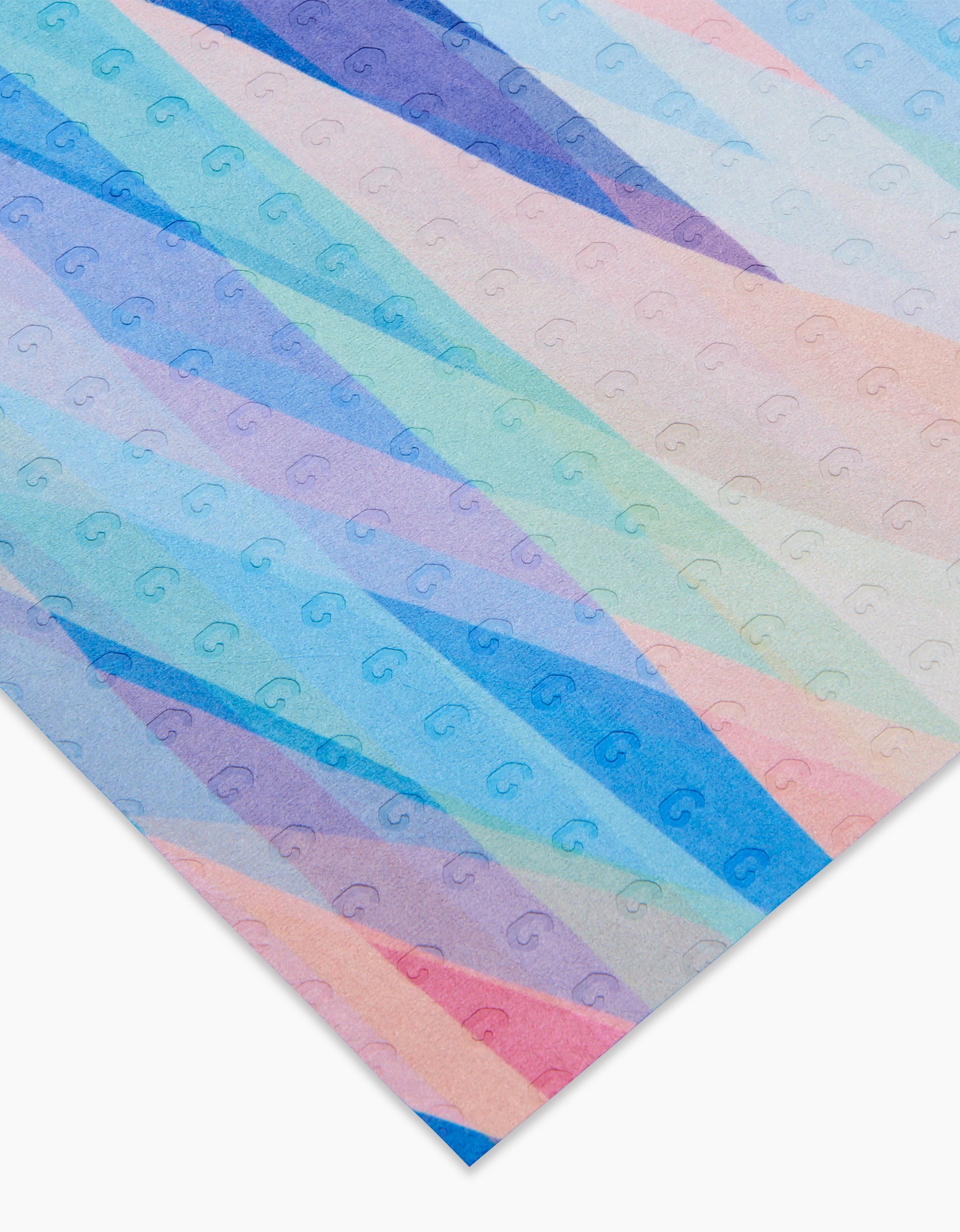 Eventide by Rachel Parker is a sheet of paper with diagonal pastel stripes in blue, purple, pink, and peach plus a repeating small G pattern—crafted from eco-friendly, post-consumer recycled materials.