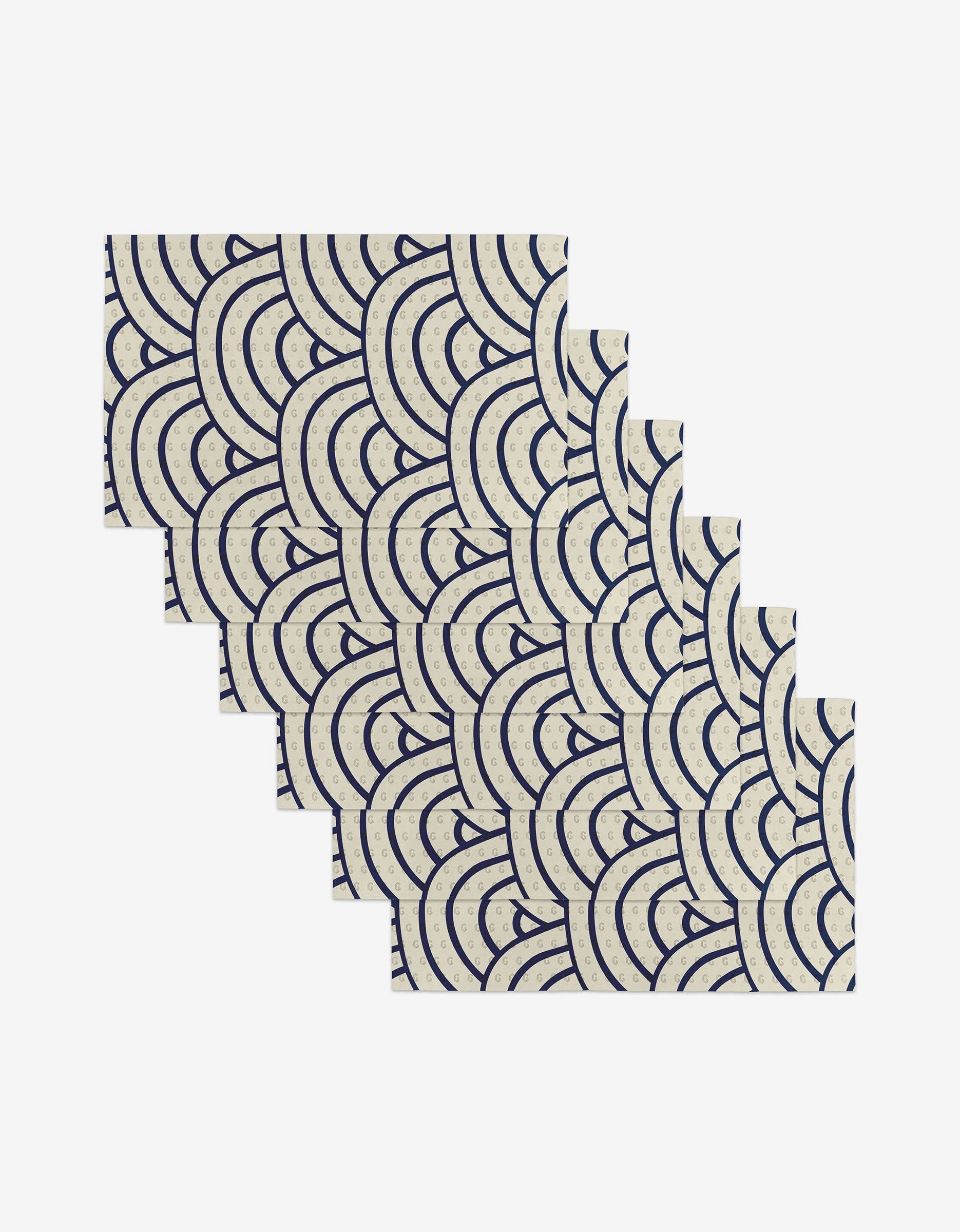 The GEOMETRY Every Level set includes six rectangular cards crafted from post-consumer recycled materials, with repeating navy blue wave patterns on a cream background, arranged in a staggered, overlapping layout on white.