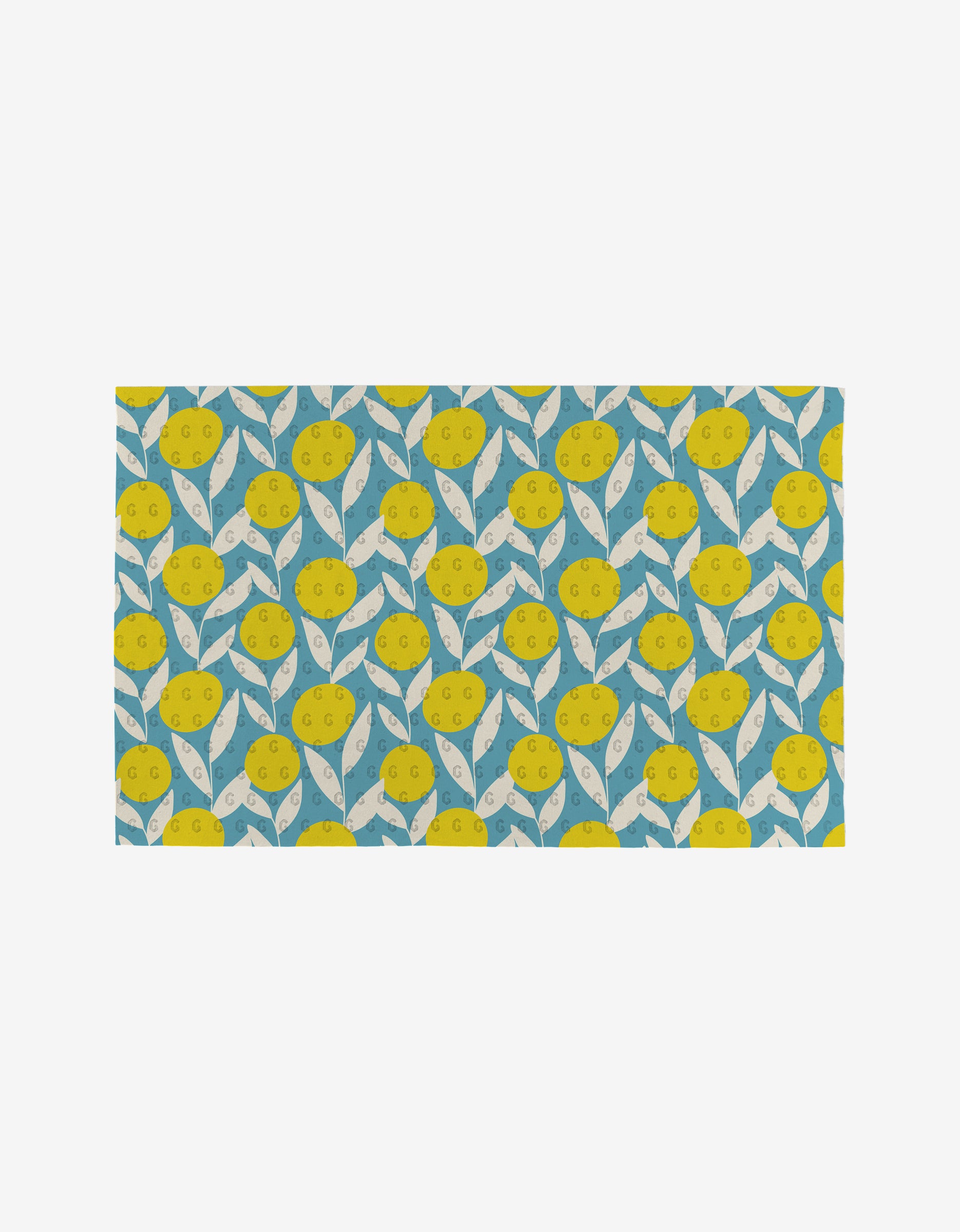 Flower Parade by Lizzie Clark is a rectangular mat with a bright yellow lemon and white leaf pattern on blue, made from post-consumer recycled materials—an eco-friendly, playful addition to your home.