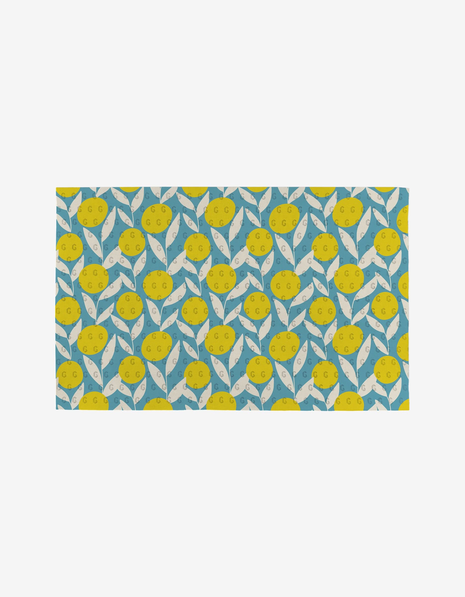 Flower Parade by Lizzie Clark is a rectangular mat with a bright yellow lemon and white leaf pattern on blue, made from post-consumer recycled materials—an eco-friendly, playful addition to your home.