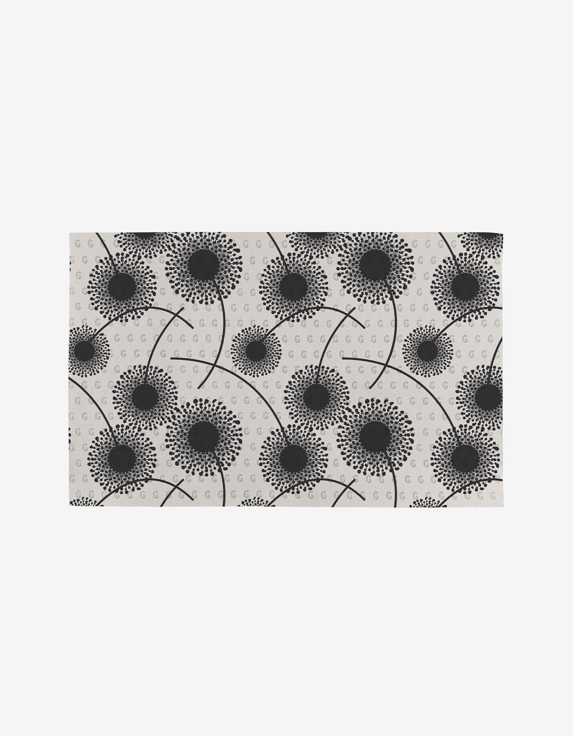 Fully Bloomed is a rectangular mat with a white background, showcasing a modern, abstract pattern of black dandelion flowers and dots—an eco-friendly, reusable alternative to Not Paper Towels.