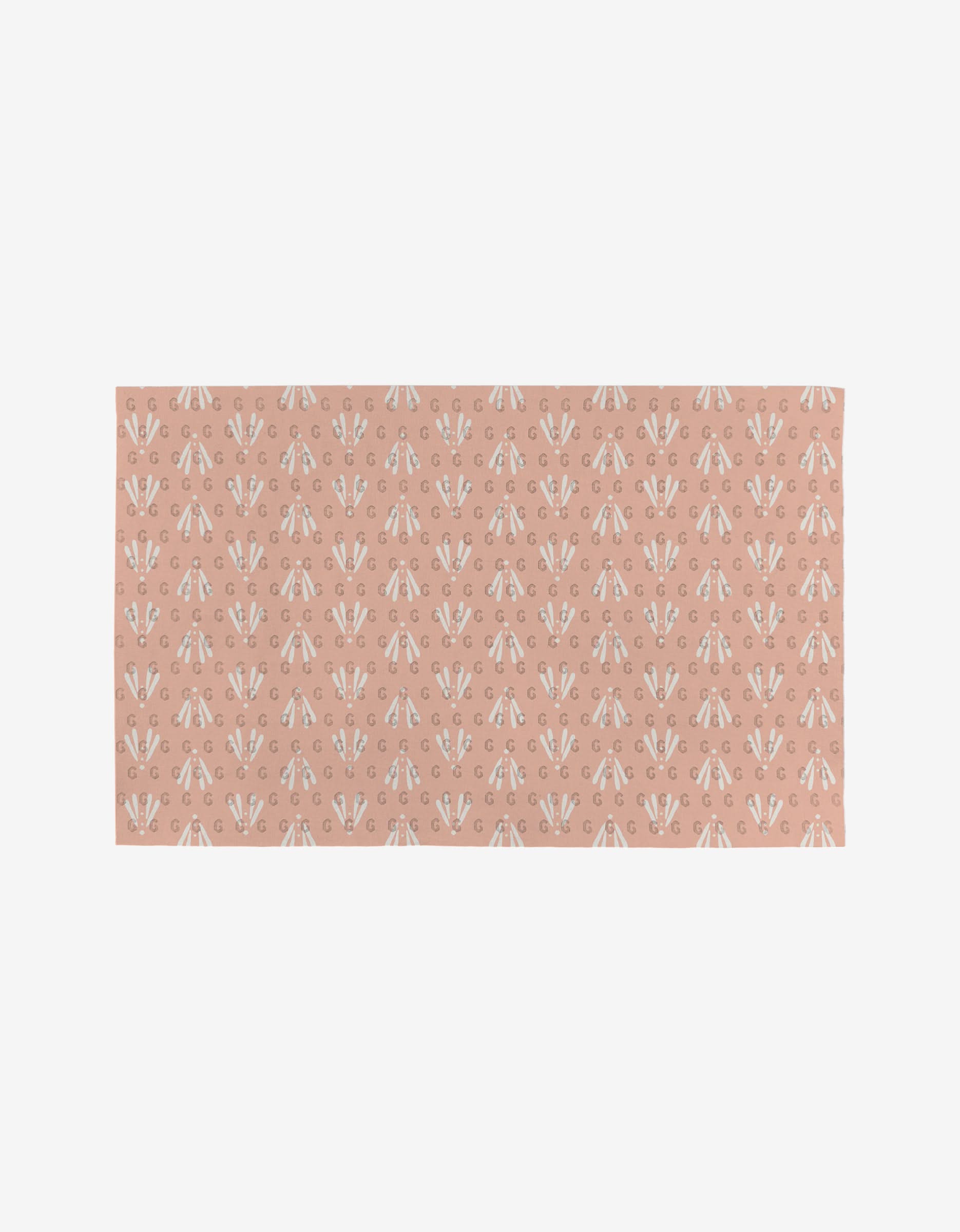 The Hufton Studio Garden Bloom rug features a muted pink background with evenly spaced white and beige floral motifs, crafted from eco-friendly materials.