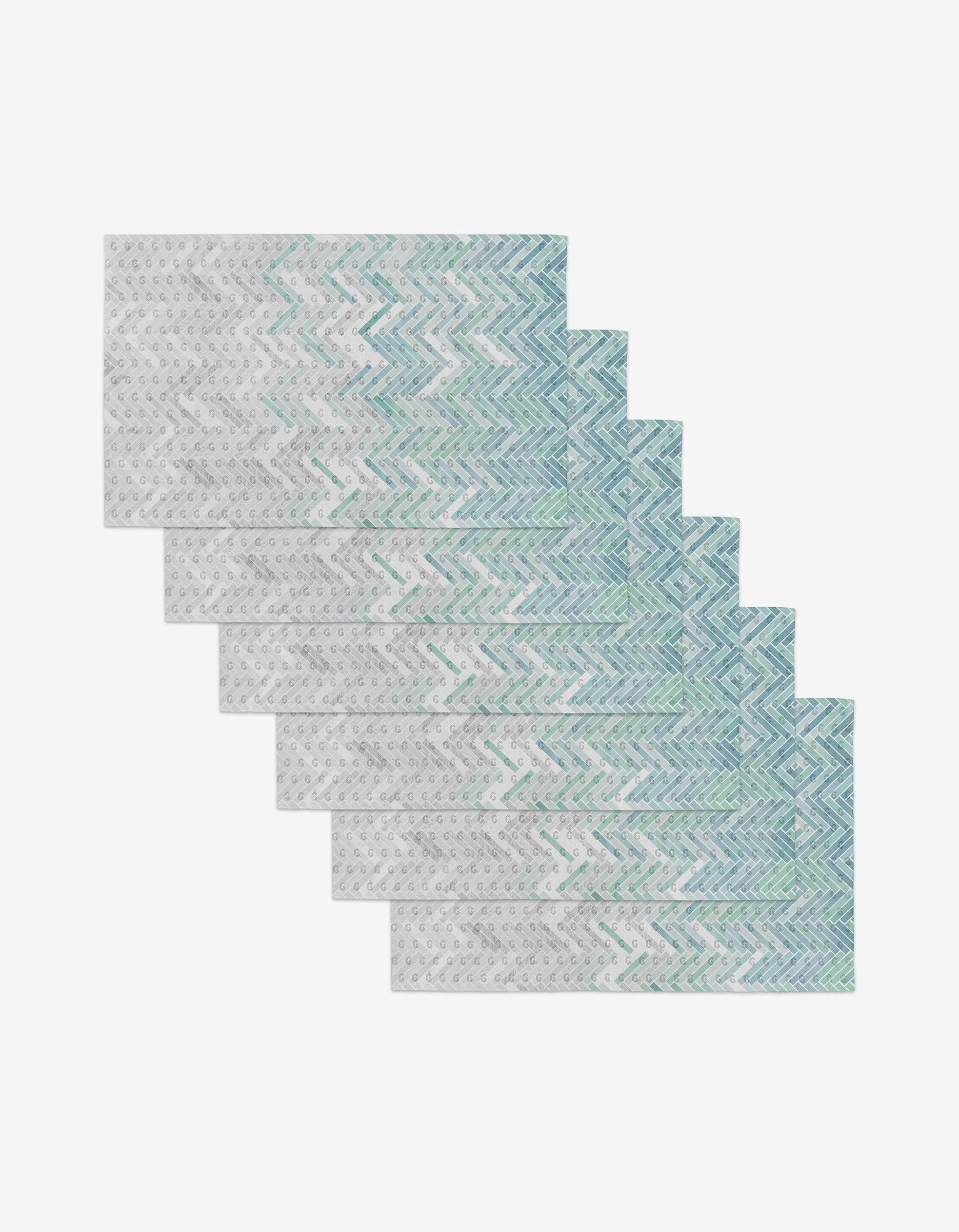 The GEOMETRY Going Up set includes six reusable rectangular cloth napkins featuring a blue and green zigzag pattern with gray dots on white—a stylish, eco-friendly alternative to paper towels.