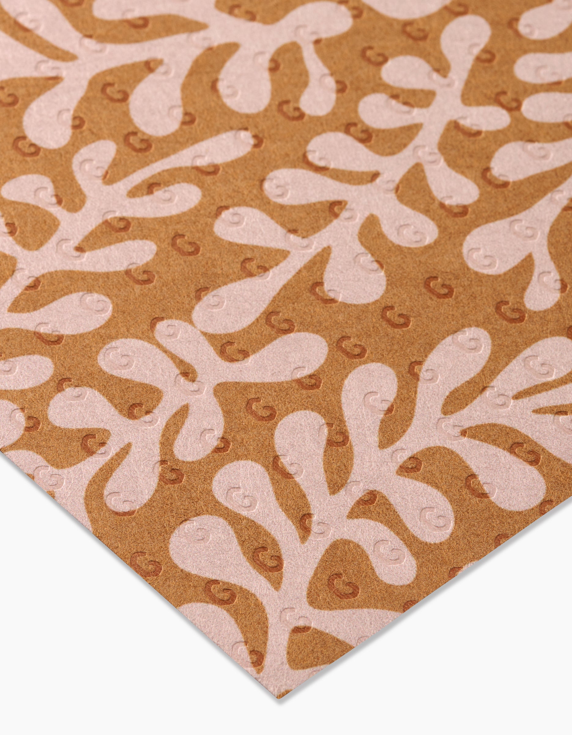 Golden Fall by GEOMETRY is a brown sheet of paper featuring a light pink, abstract leaf pattern with small repeating G symbols, crafted from eco-friendly post-consumer recycled materials.