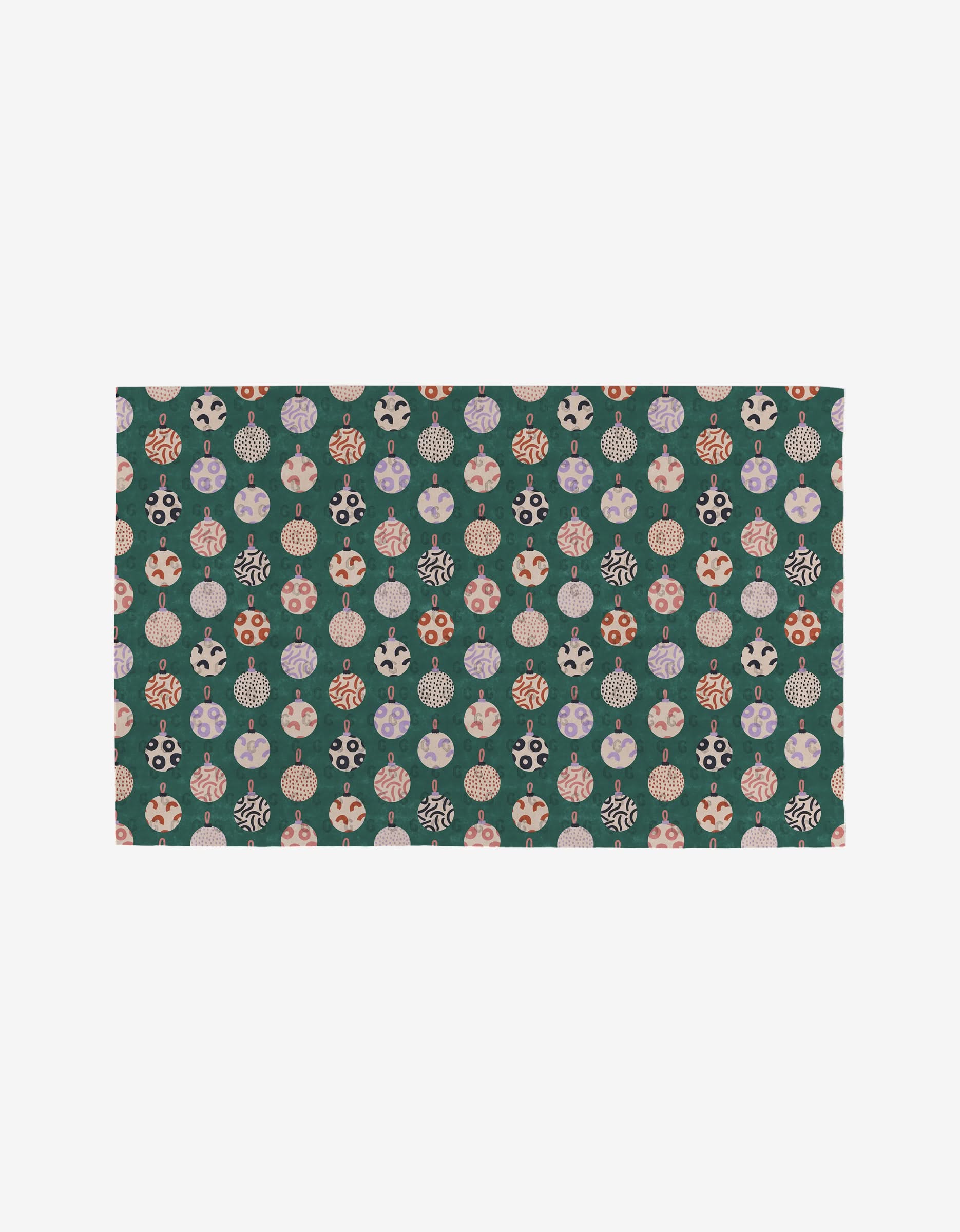 The Happy Holly rug by Claire Iglesias is rectangular, showcasing colorful Christmas ornaments with stripes, polka dots, and snowflakes on a dark green background. Made from post-consumer recycled materials.