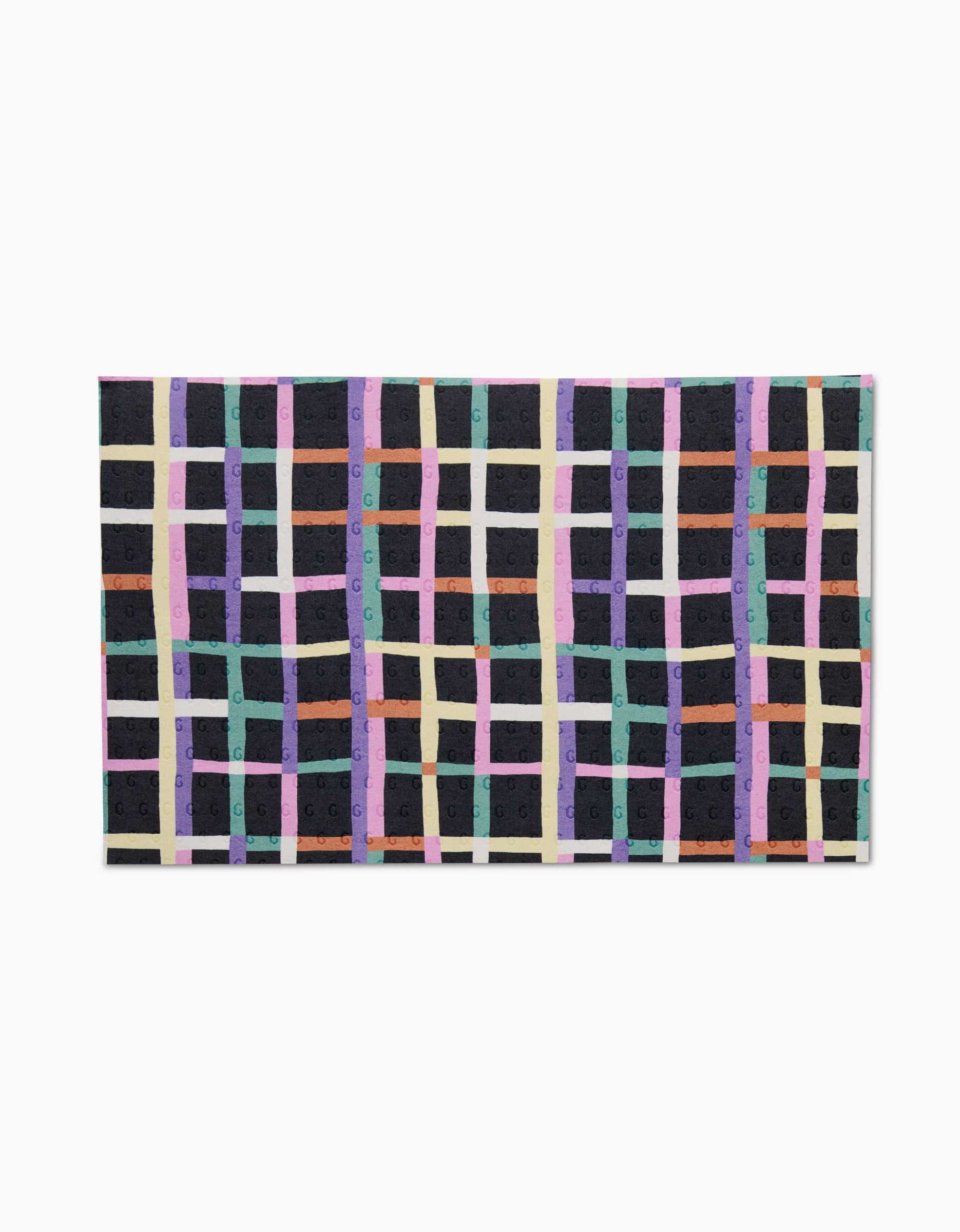 The Happy Plaid rug by Claire Iglesias features a grid pattern of intersecting purple, teal, beige, orange, and green lines on a dark background. Made from post-consumer recycled materials, it’s an eco-friendly choice for your space.