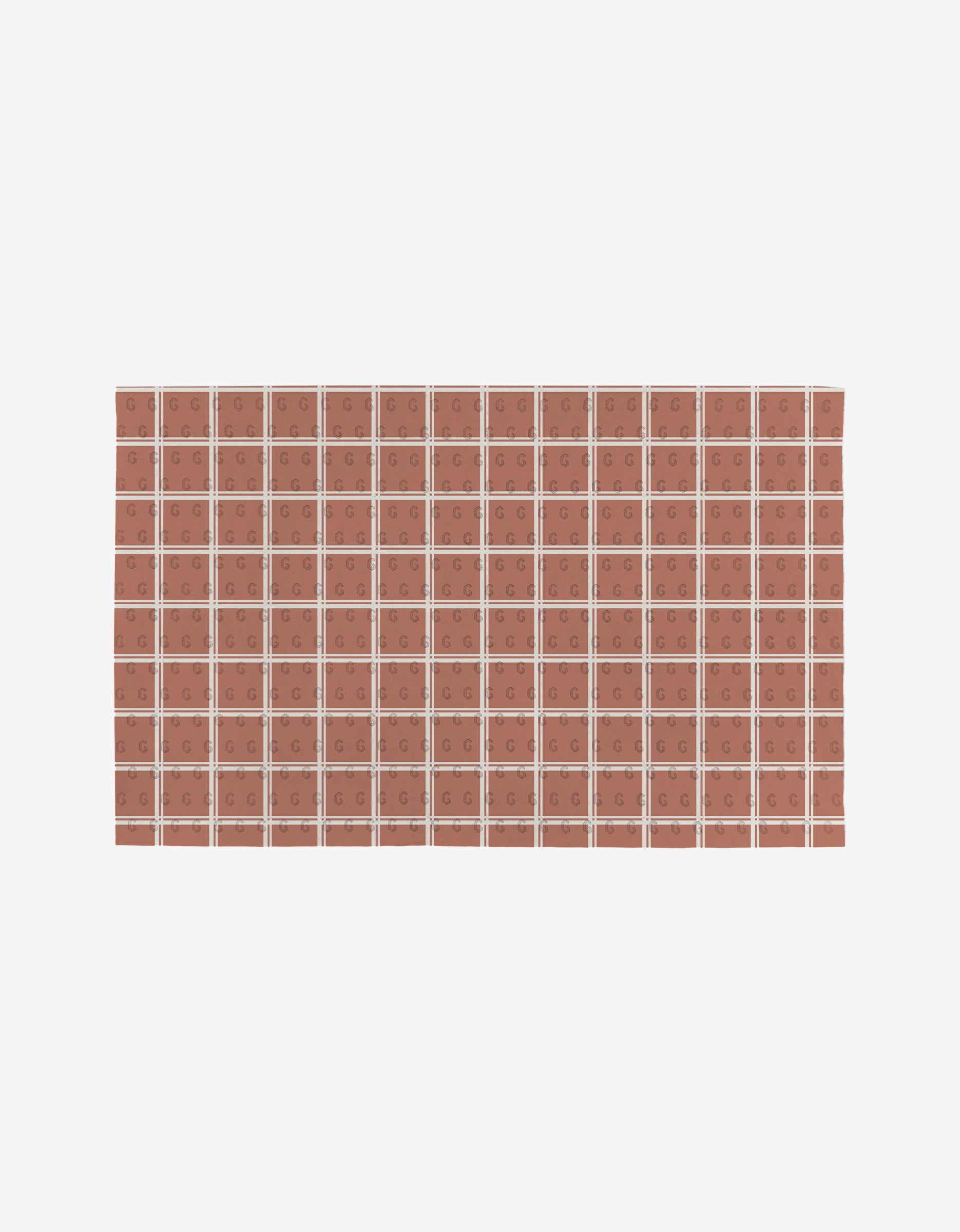 The Harvest Season tiles by Charlie Rowan Designs form a reusable rectangular grid of reddish-brown tiles with white grout lines, each tile featuring a simple geometric design, shown against a plain white background.