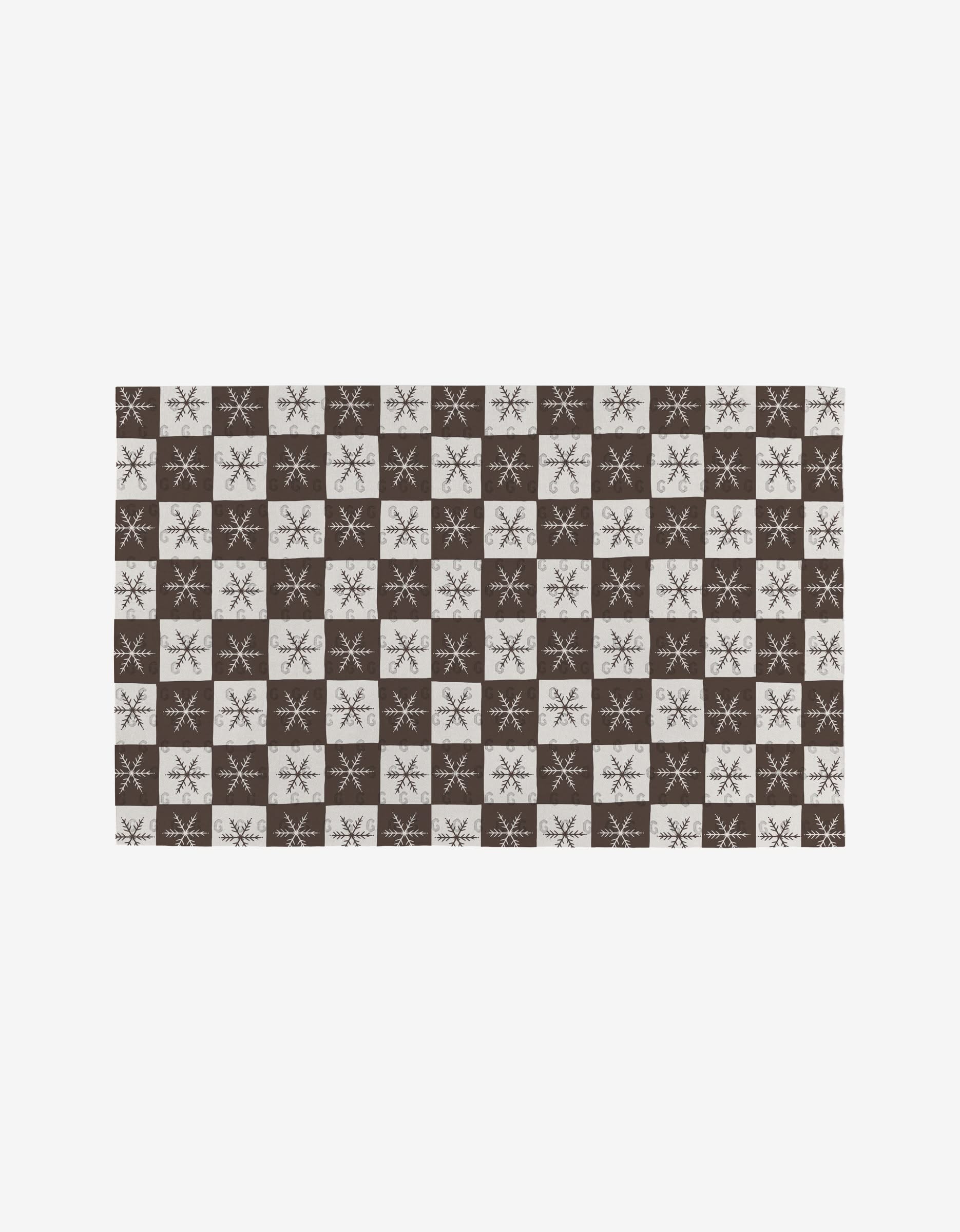 Holiday Love by Elana Gabrielle is a rectangular, reusable rug with a brown and white checkerboard pattern—white squares feature brown snowflakes, brown squares have white snowflakes—making it an eco-friendly accent for your space.