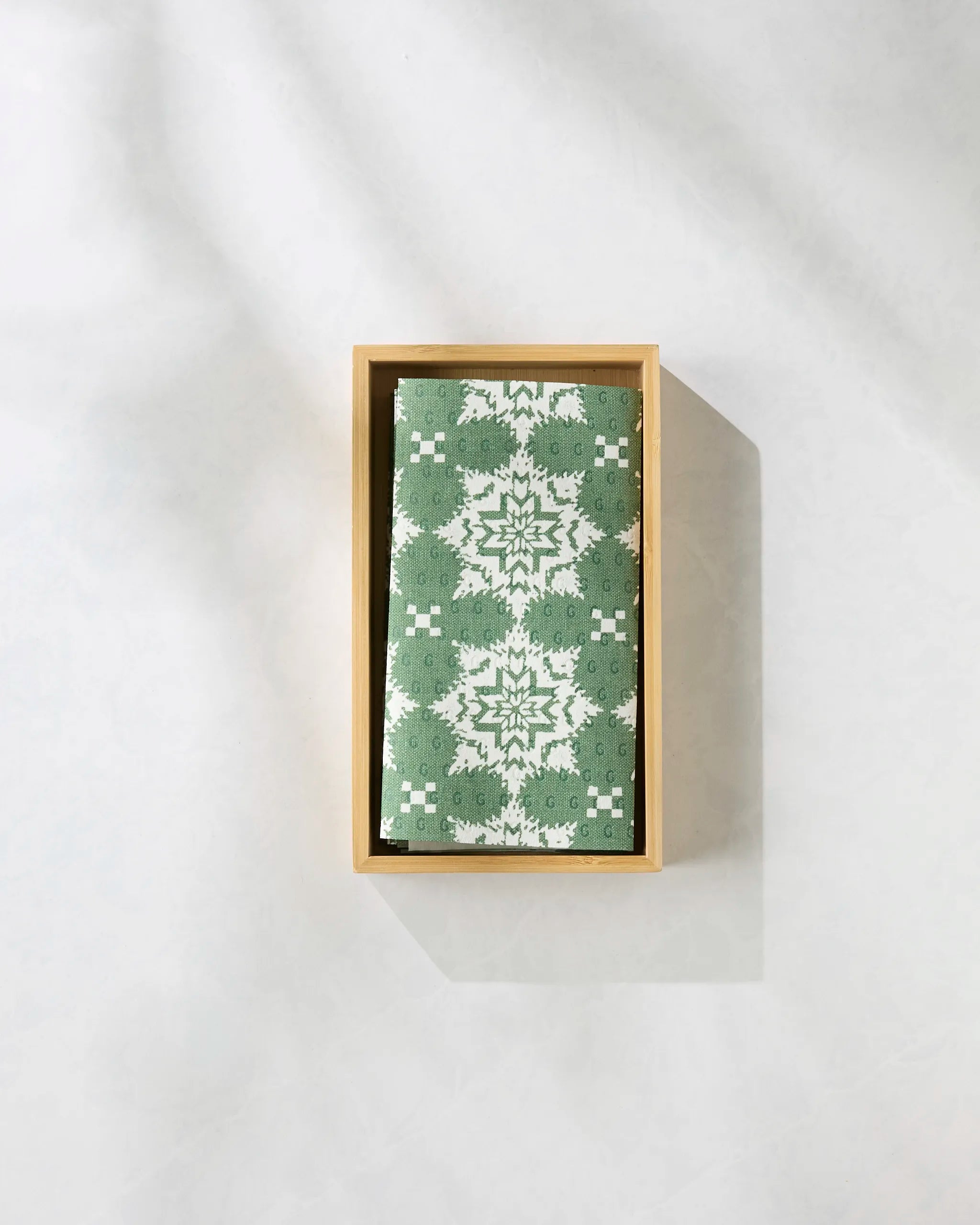 The Geometry Iceflower Green box features a green and white patterned fabric with a symmetrical, floral-like design—ideal for stylishly storing your eco-friendly, reusable paper towels.