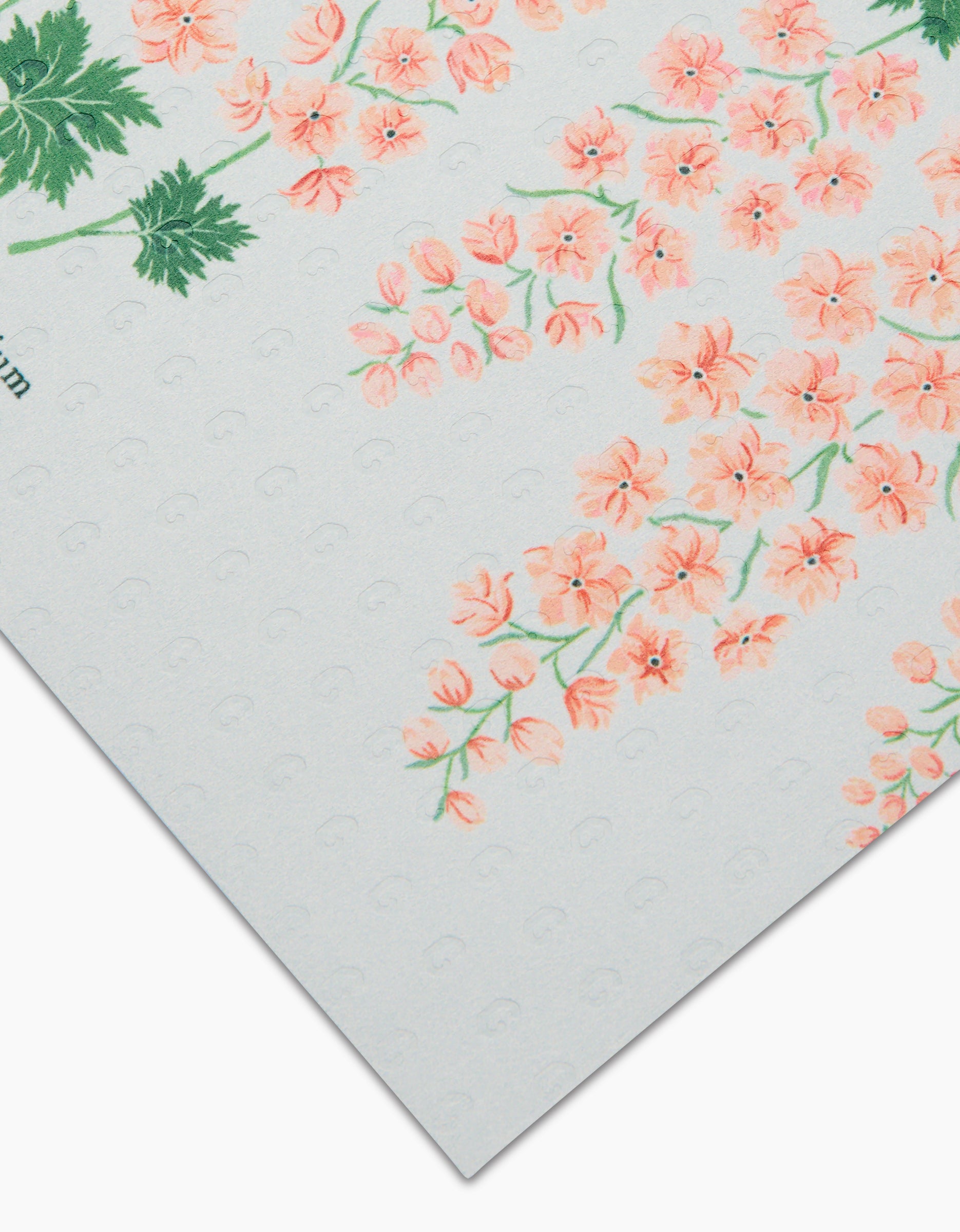 A close-up of July Delphinium by Linda Fox: textured white Not Paper Towels featuring clusters of small pink flowers and green leaves, printed on eco-friendly, post-consumer recycled materials.