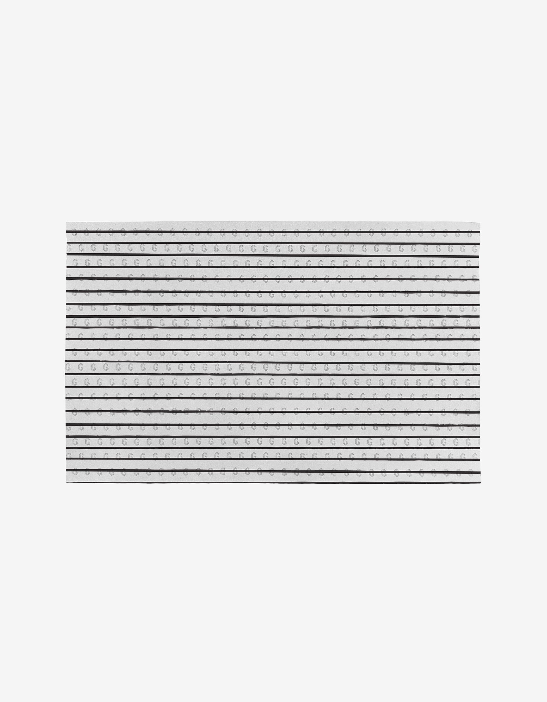 The GEOMETRY Linen is a sheet of lined paper with alternating bold and dashed lines for handwriting practice, made from eco-friendly post-consumer recycled materials, shown on a plain white background.