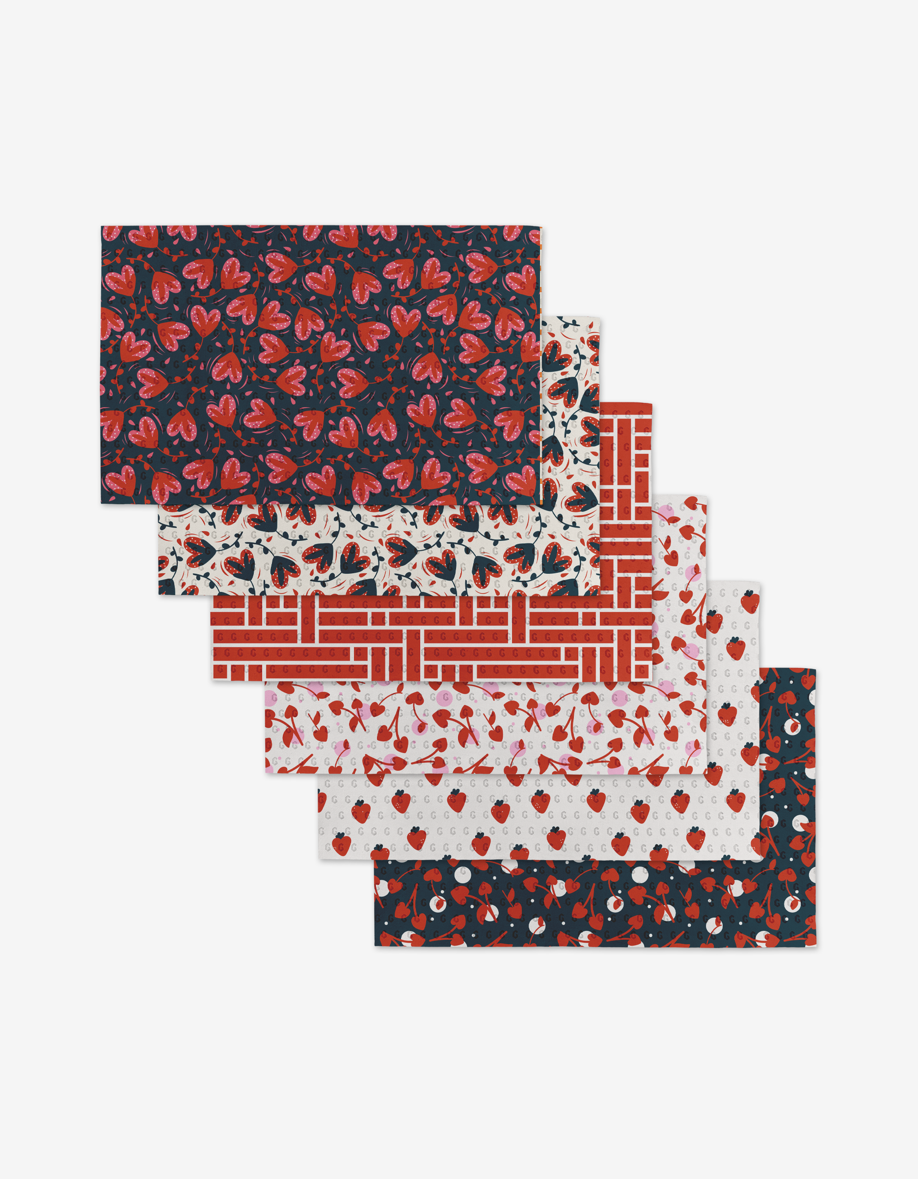 Six reusable rectangular sheets from Charlie Rowan Designs Love Blooms collection—featuring tulips, swans, brick, cherries, hearts, and apples in red, black, and white—are fanned out on a white background. These are environmentally friendly Not Paper Towels.