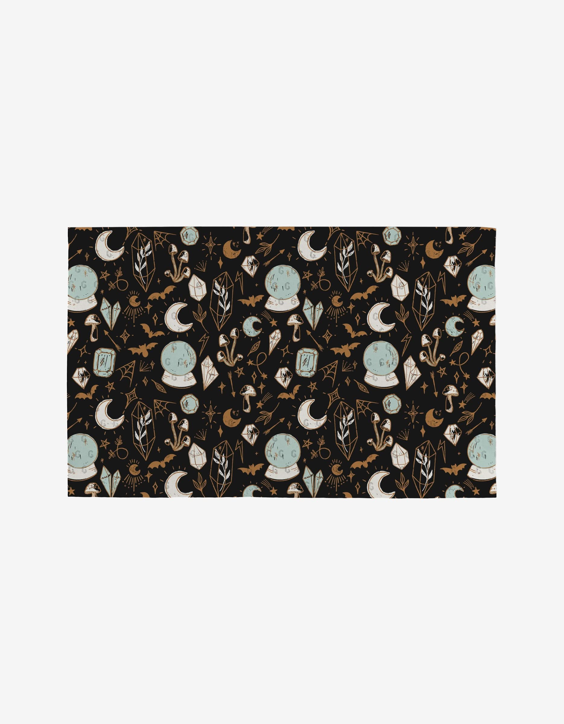 Love Potions by Hufton Studio features a seamless pattern with crystal balls, moons, stars, bats, crystals, mushrooms, and candles in muted tones on black—an eco-friendly choice for stylish decor.