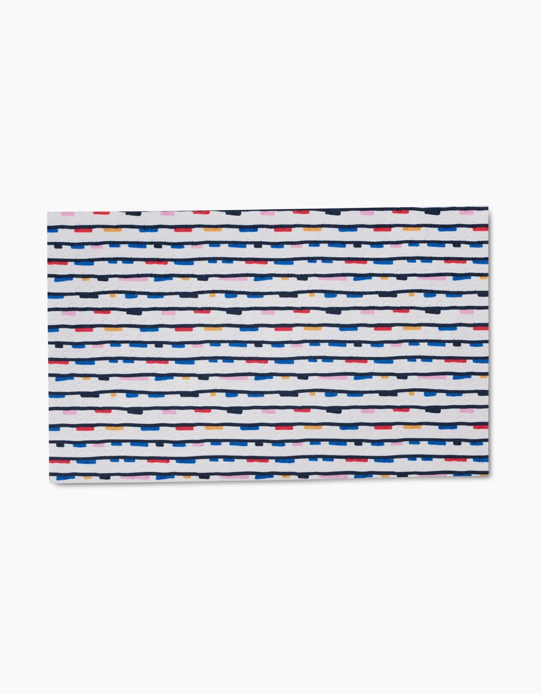 The Happy Hemera Magic Wand features a rectangular shape with a white background and horizontal rows of irregular, short dashes in navy blue, red, gold, and pink. Crafted from recycled materials for an eco-friendly touch and modern style.