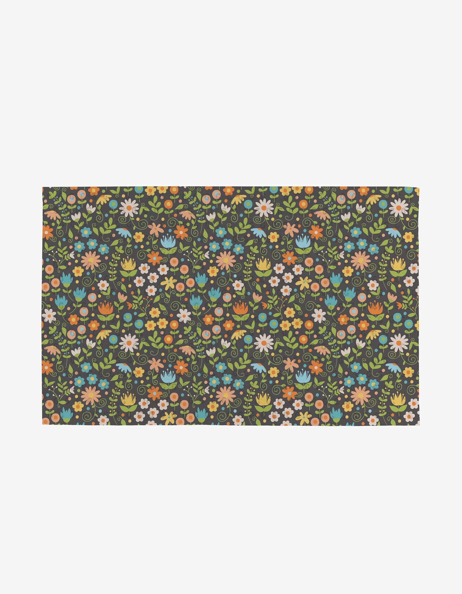 The Mindfulnice Mindful Medley is a reusable, eco-friendly rectangular mat with a dark background and a vibrant floral pattern in orange, yellow, blue, pink, white, and green—perfect alternative to paper towels.