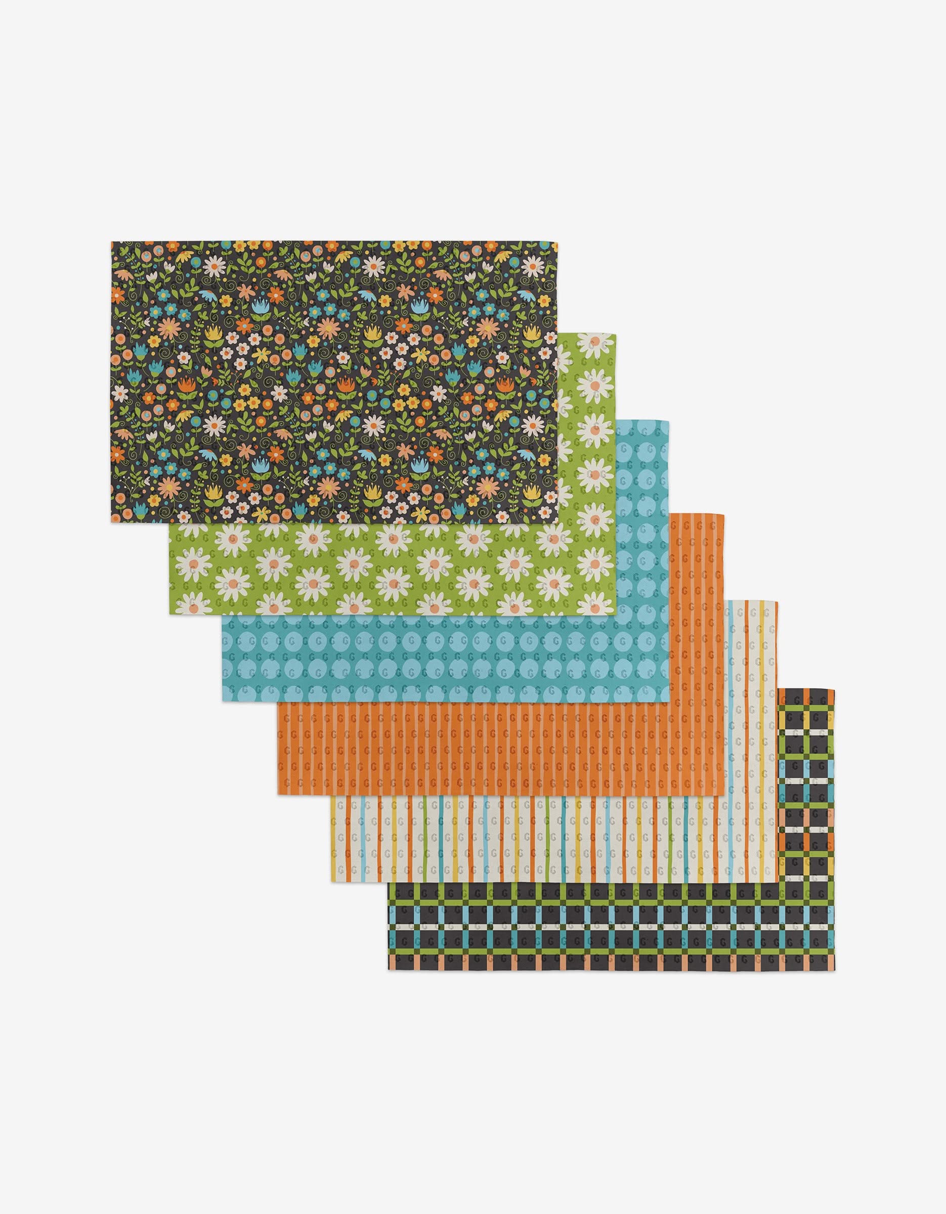 Six rectangular Mindfulnice Mindful Medley reusable Not Paper Towels are fanned out, each displaying a unique colorful print like florals, polka dots, stripes, and plaid—perfect for eco-friendly homes.