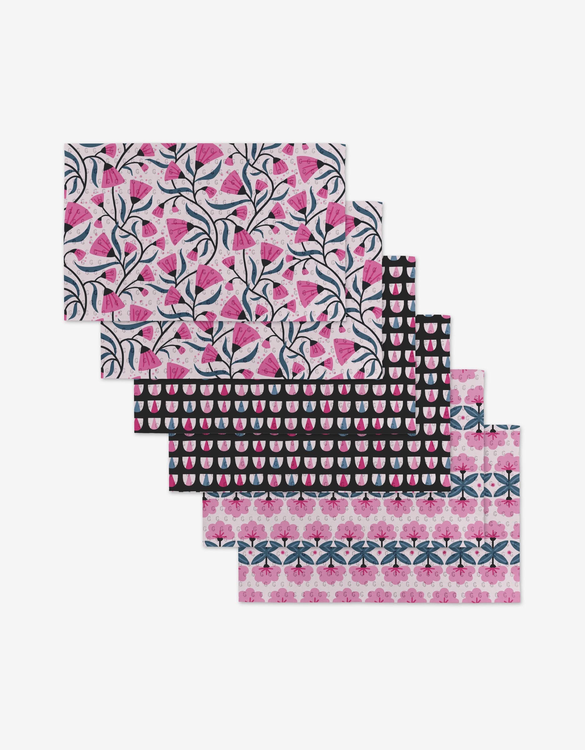 Five reusable rectangular sheets from Anette Heibergs Petal Symphony, featuring assorted pink and navy botanical designs, stacked in a fan. These eco-friendly sheets are a sustainable alternative to Not Paper Towels.