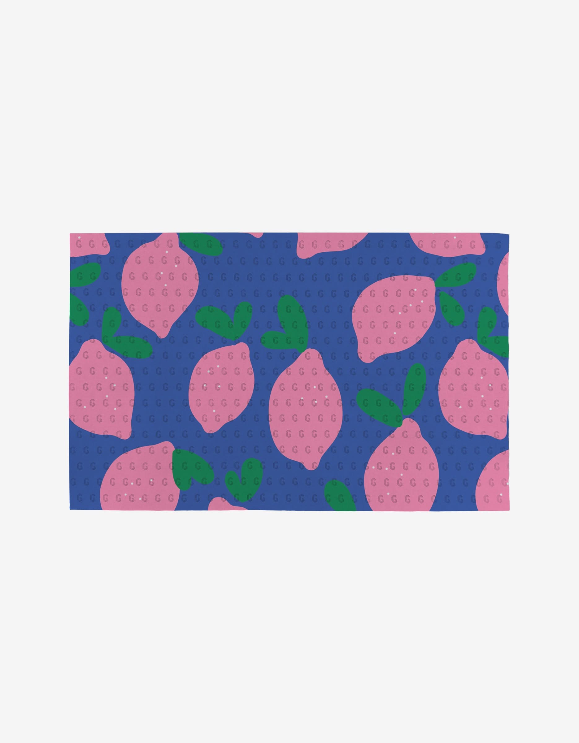 The Pink Lemons mat by Jennifer Bouron is a rectangular, eco-friendly mat with a blue background, pink lemon and green leaf pattern, and a raised dot texture.