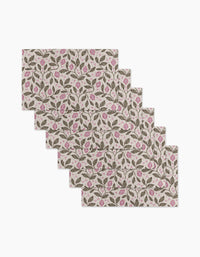 Six rectangular placemats—Pink Summer Lemons by Teri the Butter—feature a repeating pattern of green leaves and pink flowers on a light background, made from eco-friendly kitchen towels for sustainable dining.